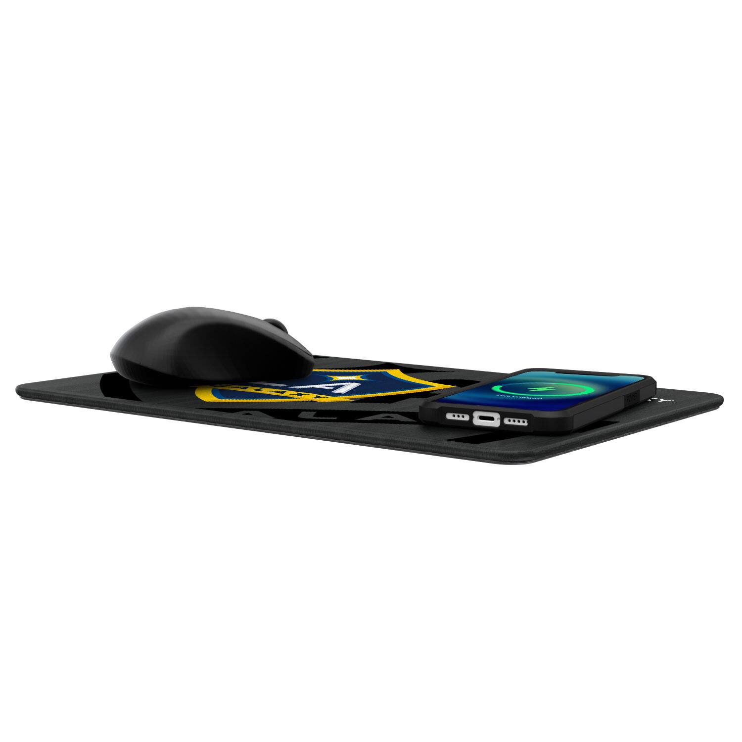 The image shows a gaming mouse and a smartphone placed on a mouse pad. The mouse pad has a design featuring a shield with a lightning bolt and the text "Razer" on it. The smartphone is connected to a charging dock with a green light on the screen.