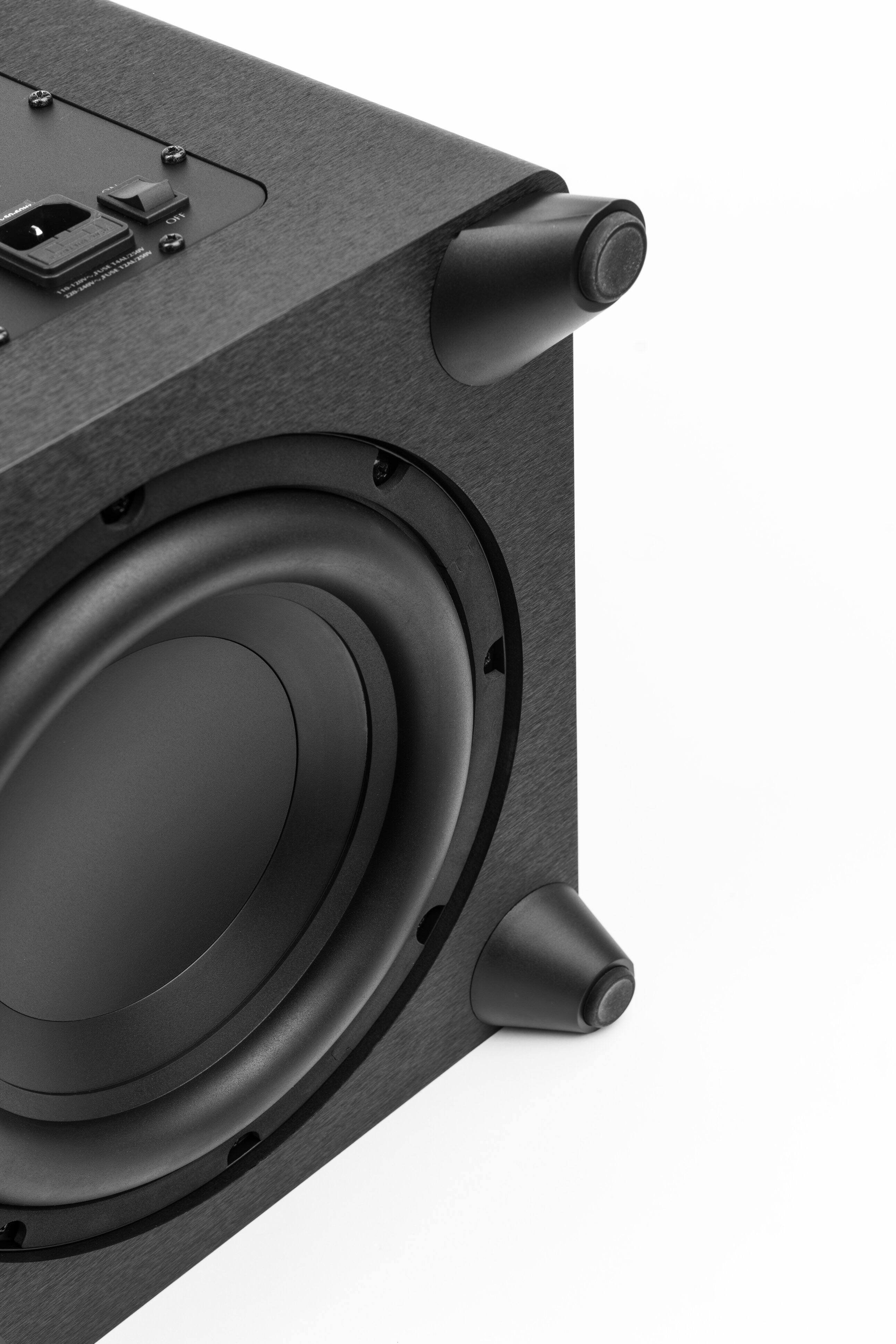 I'm sorry, but the text you provided does not make sense and does not seem to be related to the image. The image shows a black speaker with a black box on top of it, placed on a white background.