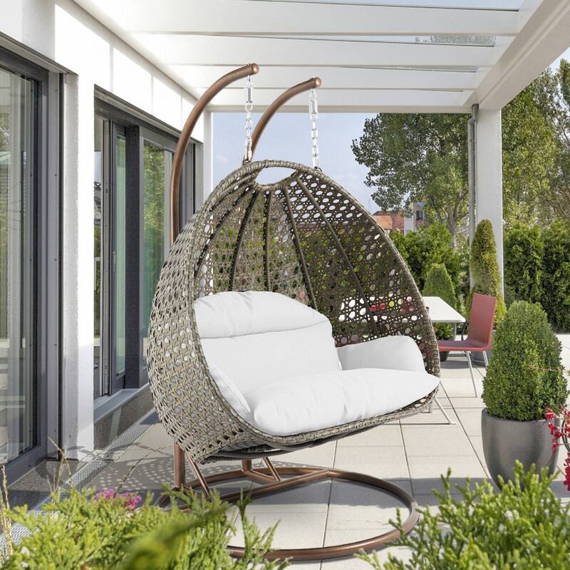 Left. LeisureMod - Leisuremod 2-Person Wicker Egg Swing Chair with Stand & Washable Cushions - Indoor/Outdoor Double Hanging Patio Chair - White.