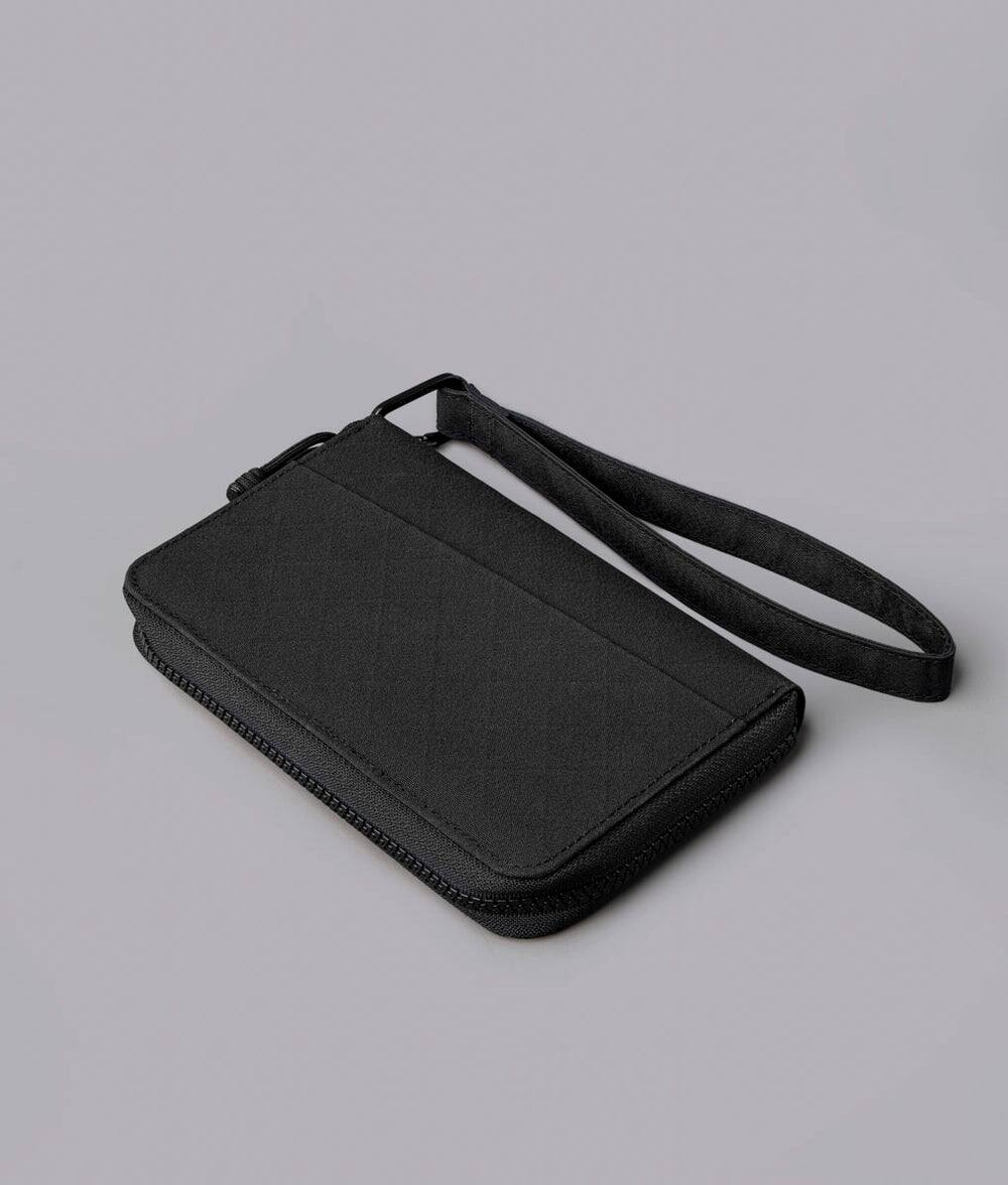 Angle. ALPAKA - RFID Zip Passport Wallet with Boarding Pass Pocket, 7 Card Slots, Magnetic Flaps, Detachable Hand Strap - Black Axogrid 300D.