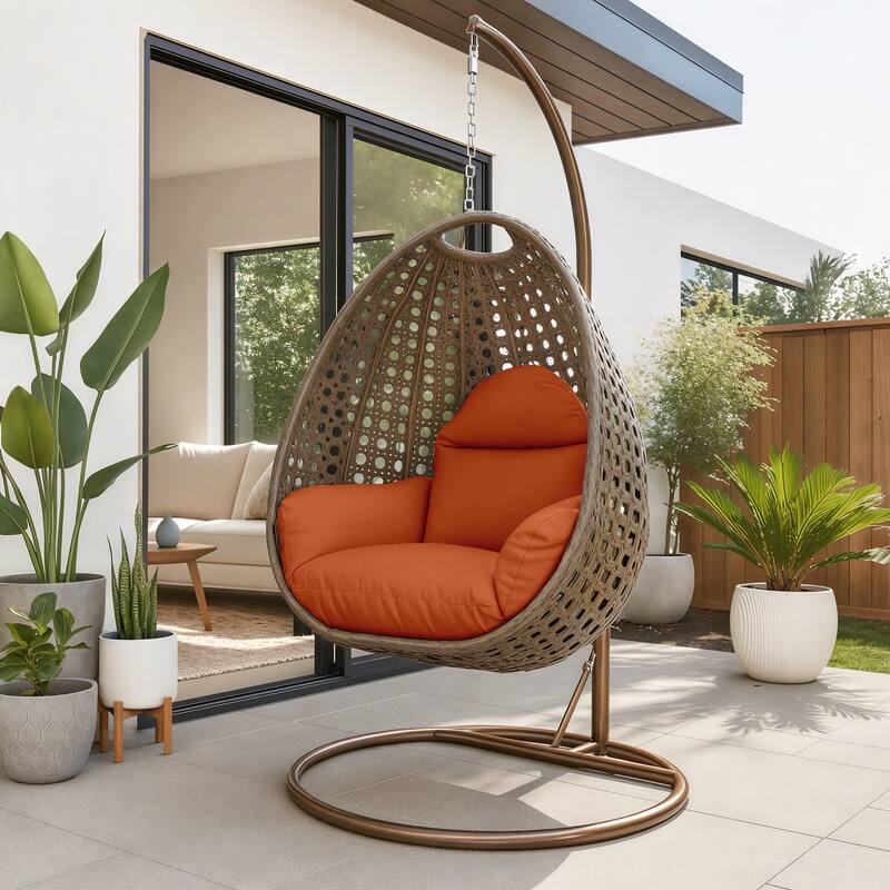 Angle. LeisureMod - LeisureMod Beige Wicker Hanging Egg Chair with Iron Stand & Cushion - All-Weather Single Outdoor Patio Swing - Orange.