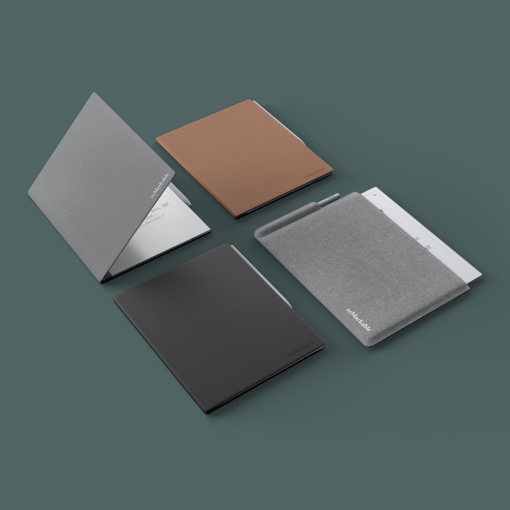 The image features four different colored books, each with a unique color. The books are displayed on a white background, and they are all open to show their covers. The colors of the books are black, brown, gray, and white. The books are arranged in a way that they are all visible, with one book on the left side, one on the right side, and two books in the middle. The books are placed in a way that they are all easily distinguishable, making it clear that there are four different colored books in the image.