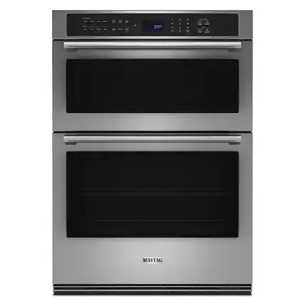 The text on the image reads "201 - . . - . + - . . v X MAYTAG." This text is likely a code or information related to the oven's features or settings.