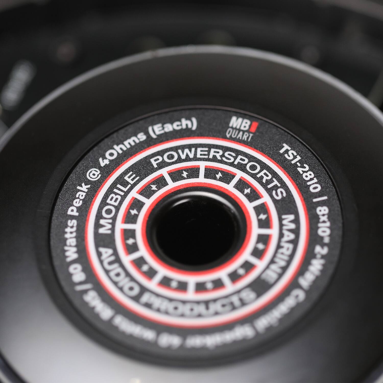 The text on the image reads: "Each MB Quart 40hms Powersports TS1-2810 @ Peak Mobile - Watts 8x10 80 - Audio Marine 2-Way RMS Products Consume -". The corrected text would be: "Each MB Quart 40hms Powersports TS1-2810 @ Peak Mobile - Watts 8x10 80 - Audio Marine 2-Way RMS Products Consume -".