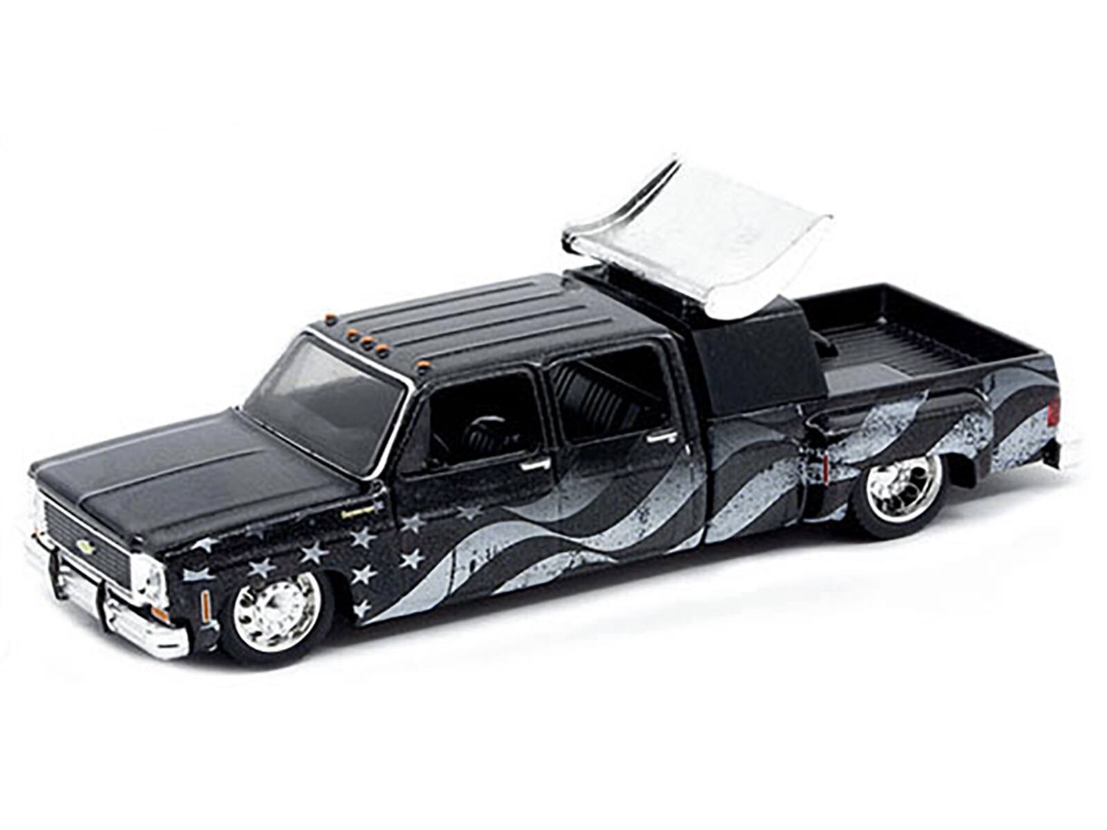 Angle. M2 - 1973 Chevrolet Cheyenne Super 30 Pickup Truck Black with American Flag Graphics 1/64 LTD 8250pcs Worldwide - Black with American Flag.
