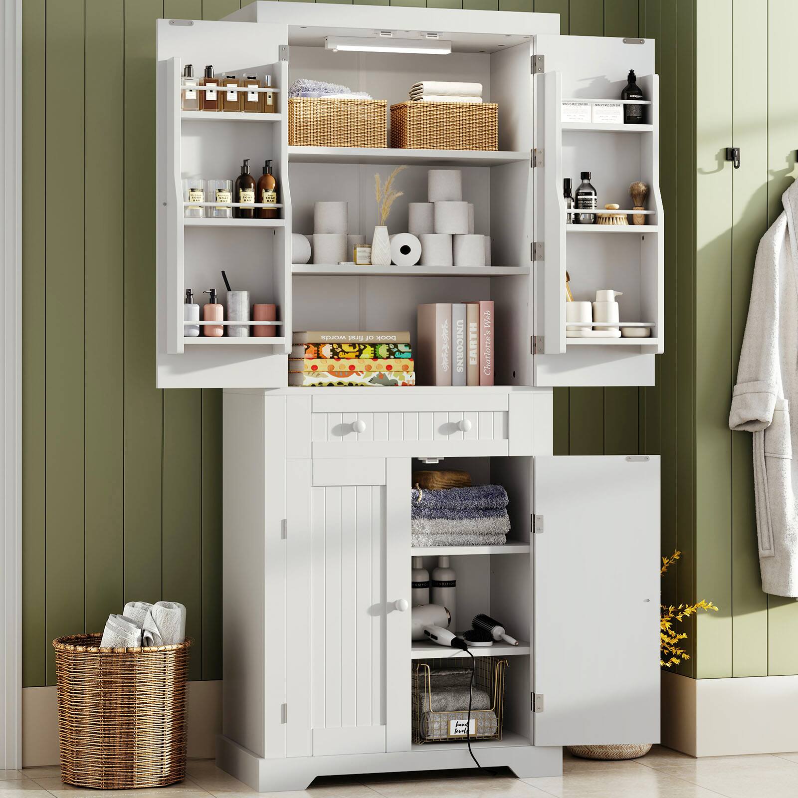 The image features a white cabinet with a drawer and a shelf. The shelf is filled with various items such as bottles, towels, and books. The drawer is also filled with towels and other items. The cabinet is located next to a wall, and there is a basket nearby.