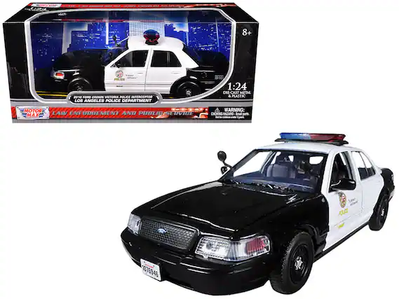 Sure, here is the corrected and grouped text from the image:
---
**Front of the Box:**
- **Top Left Corner:** MOTOR MAX
- **Top Center:** LAW ENFORCEMENT AND PUBLIC SERVICE
- **Main Text:** 2010 FORD CROWN VICTORIA POLICE INTERCEPTOR LOS ANGELES POLICE DEPARTMENT
- **Bottom Left:** 1:24 DIE-CAST METAL & PLASTIC
- **Bottom Right:** WARNING: CHOKING HAZARD - Small parts. Not for children under 3 years.
**Side of the Box:**
- **Top Right:** 8+
- **Middle Right:** 1:24 DIE-CAST METAL & PLASTIC
- **Bottom Right:** WARNING: CHOKING HAZARD - Small parts. Not for children under 3 years.
**On the Car:**
- **License Plate:** 1076946
- **Side Text:** LOS ANGELES POLICE DEPARTMENT
- **Badge:** POLICE
**Additional Text on the Box:**
- **Top Right Corner:** 272222220
- **Top Center:** FA 20EL0