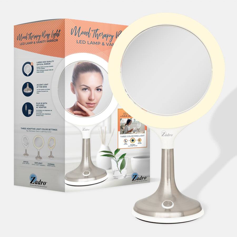 Mool Therapy Ring Light  
LED LAMP & VANITY MIRROR  

- LARGE HIGH QUALITY OPTICAL MIRROR  
- ACCENT LIGHT AT THE BASE  
- PLUG IN WITH INCLUDED ADAPTER  

THREE ADAPTIVE LIGHT COLOR SETTINGS  
- OFFICE  
- DAYLIGHT  
- EVENING  

THREE COLOR RING LIGHT  

Zadro