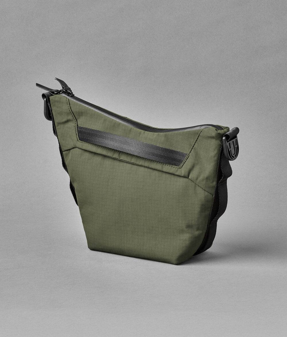 Back. ALPAKA - Flow Satchel Mini 2L Crossbody Bag, Water Resistant Shoulder Bag, Expandable Bottle Pocket, YKK Zippers - Green Axoflux 210D.