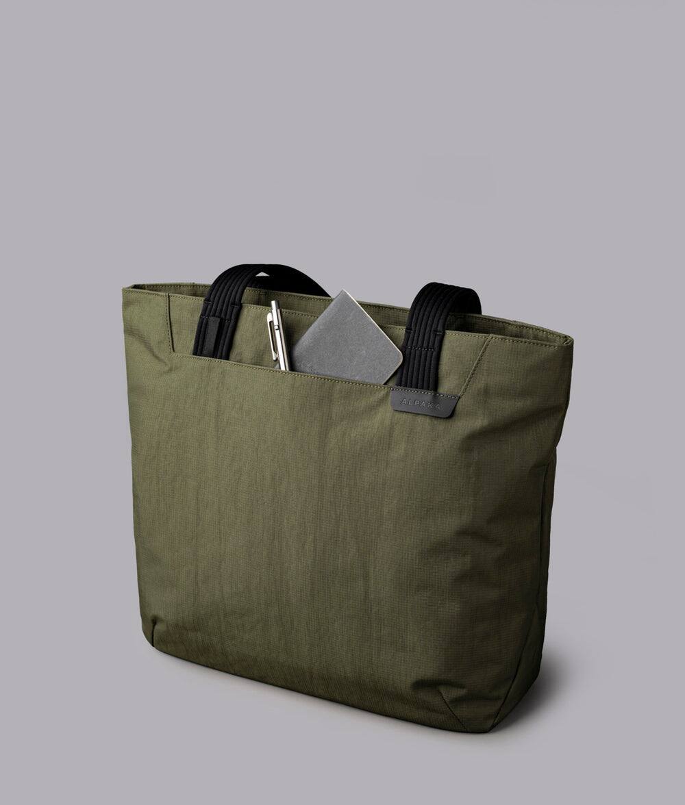 Alt View 4. ALPAKA - Flight Tote (L) Laptop Tote Bag for Work, Large Tote Bag Fits 16" MacBook Pro, Water Bottle Pocket, Luggage Pass-Through - Green Axoflux 400D.