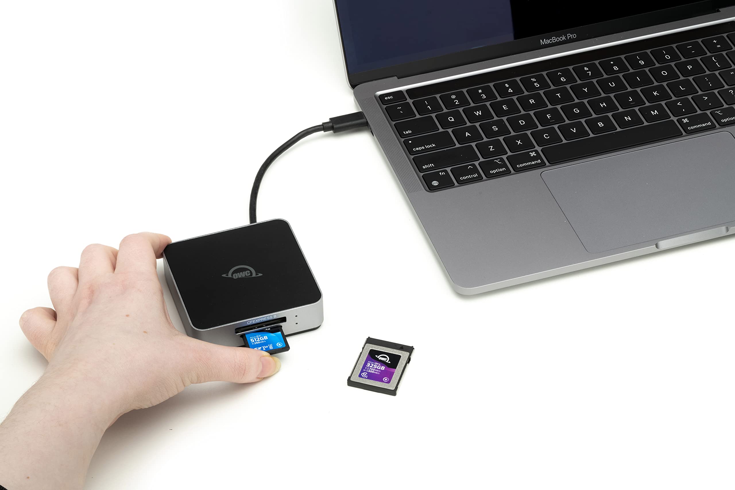 MacBook Pro & A 7% 6 S 5 M a Y .c - 3 T 2 R - 1 E W G Q F D S V Cai A C Sook x cape z 3 shits 4 command Th epthon centrol 8 U H B t 9 I J N 1 o O K M + - - a { P I - 5 L ? A < T x egAlor commana OWC CREXPRESS E 512GB 1W 325GB