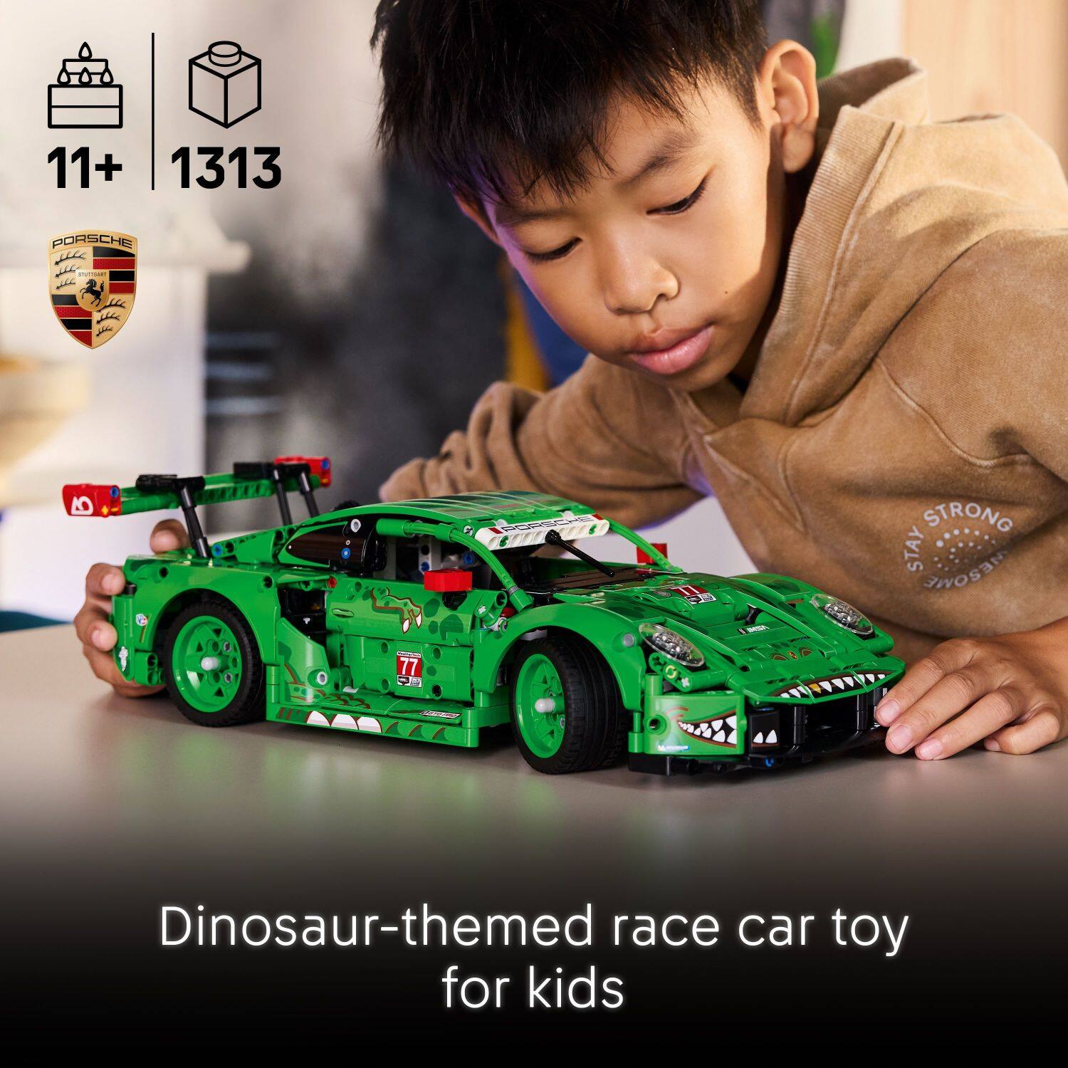 11+ 1313 PORSCHE B 77  
Dinosaur-themed race car toy for kids