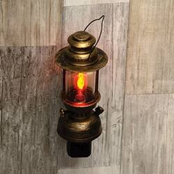 Angle. BreeBe - Distressed Bronze Finish Lantern Plug-In Nightlight w/1 W Flicker Bulb - Bronze.