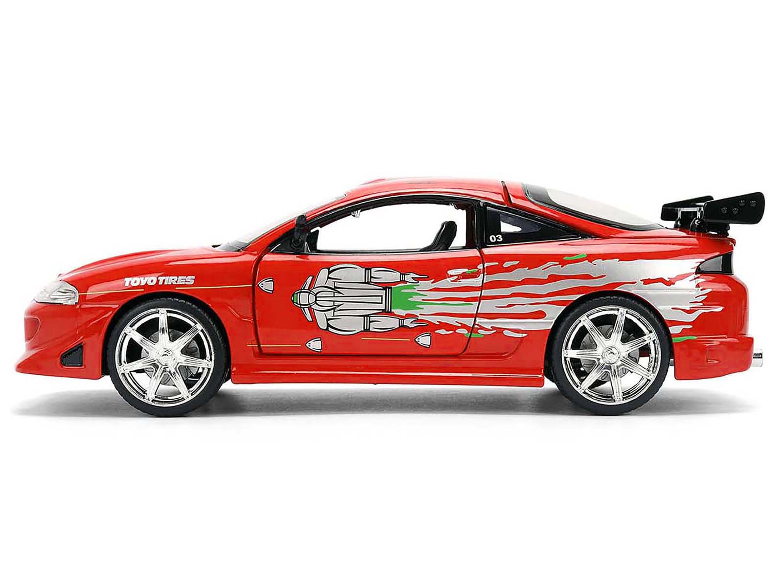 Left. Jada - Brian's Mitsubishi Eclipse Red with Graphics Remix "Fast & Furious" (2001 Movie) 1/24 Diecast Model Car by Jada - Red With Graphics.