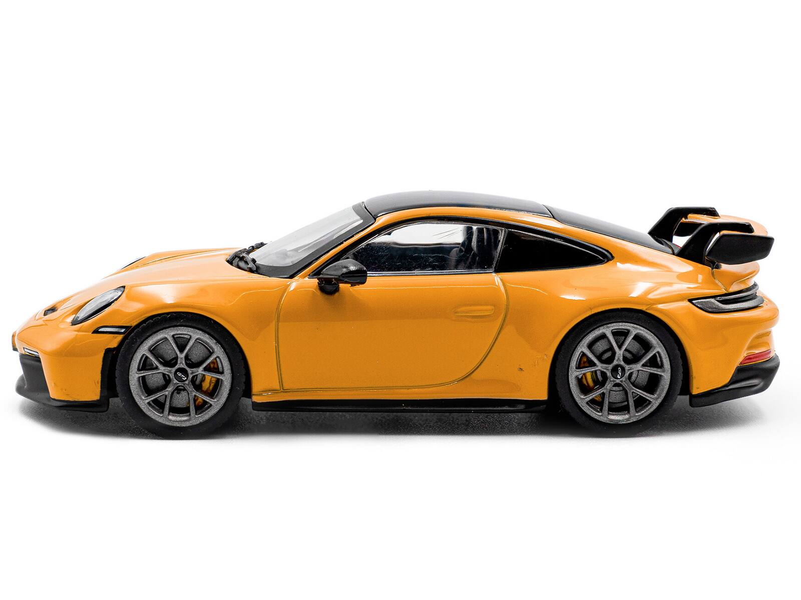 Angle. Solido - 2023 Porsche 911 (992) GT3 Signal Yellow with Black Top 1/43 Diecast Model Car by Solido - Yellow with Black Top.