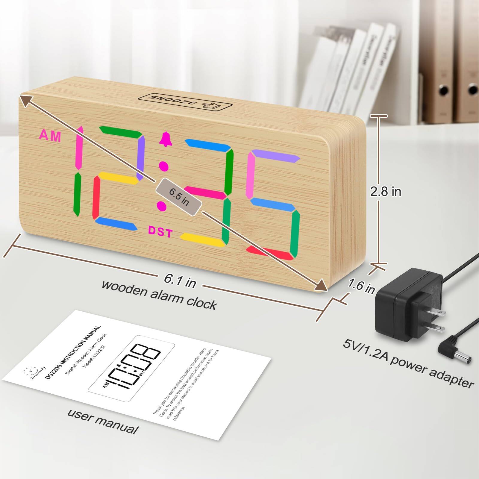 Sure, here is the corrected and grouped text from the image:

---

**SNOOZE**

**AM**  
**DST**

**6.5 in**  
**2.8 in**  
**6.1 in**  
**1.6 in**

**wooden alarm clock**

**5V/1.2A power adapter**

**user manual**

**DS2208 Instruction Manual**  
**Wooden Alarm Clock**

---

This text includes the dimensions, labels, and product information visible in the image.