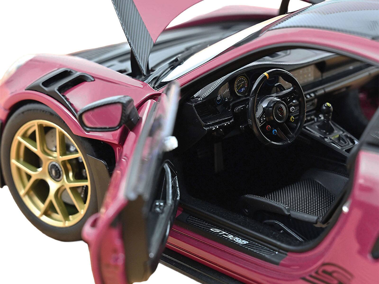 Left. Norev - 2022 Porsche 911 GT3 RS Weissach Pack Ruby Star Red with Carbon Top and Hood Stripes 1/18 Diecast Model Car by Norev - Red.