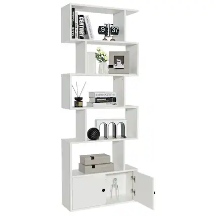 The image features a white shelf with various items on it. There are several books placed on different shelves, as well as a vase and a clock. The shelf also has a drawer, which is open, revealing a bottle inside. The arrangement of the items on the shelf creates a neat and organized look.