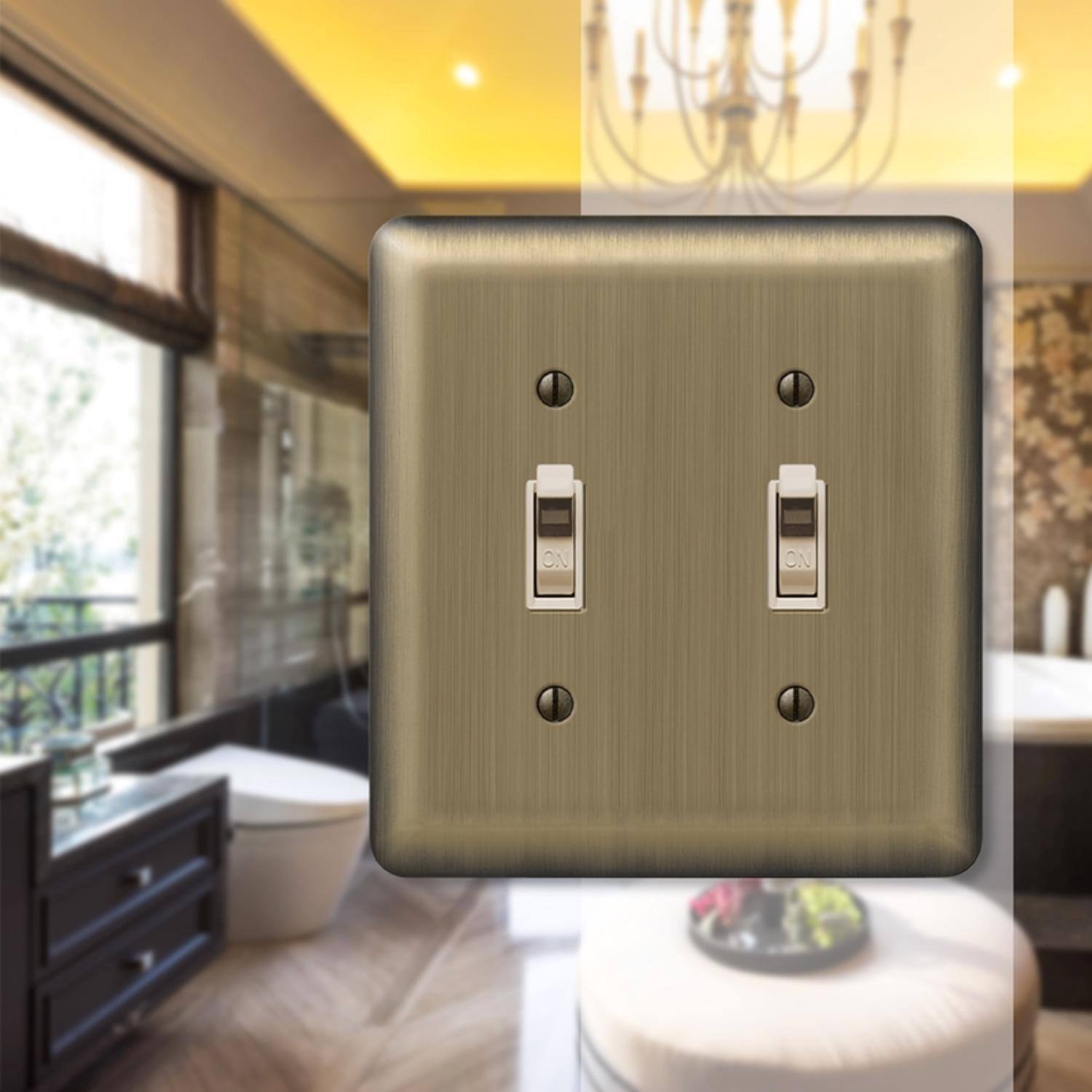 Left. AMERELLE - Amerelle Devon Brushed Brass 2 gang Stamped Steel Toggle Wall Plate 1 pk - Brass.