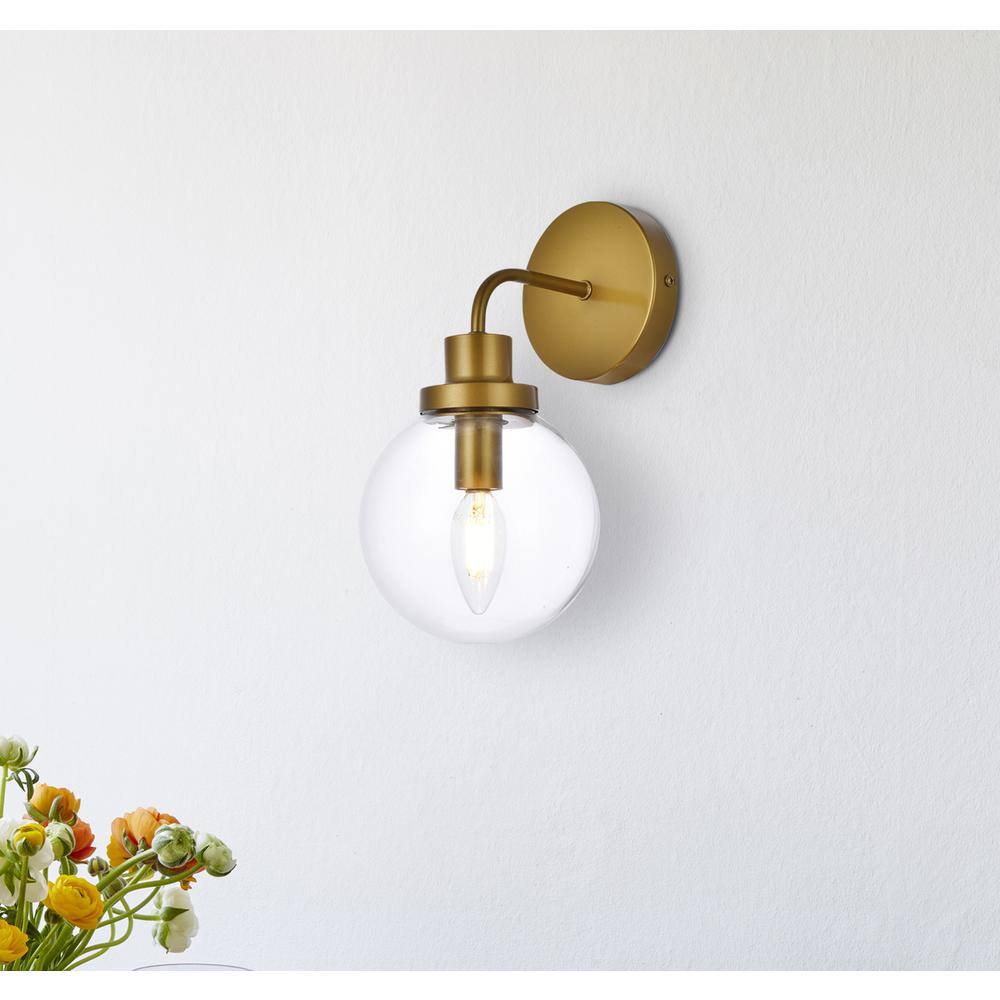 Angle. Living District - Hanson 1 light bath sconce in brass with clear shade - Brass And Clear Shade.