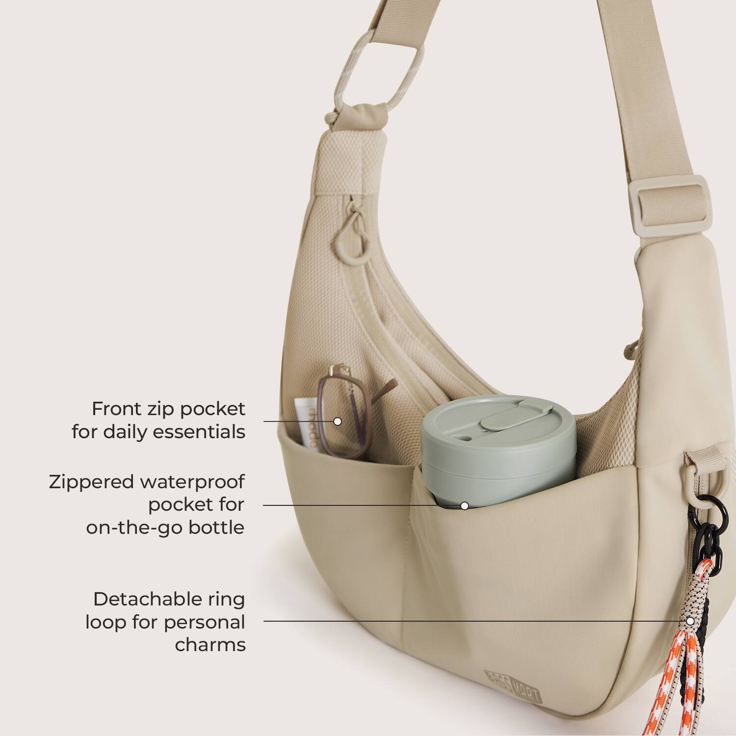 Front zip pocket for daily essentials  
Zippered waterproof pocket for on-the-go bottle  
Detachable ring loop for personal charms