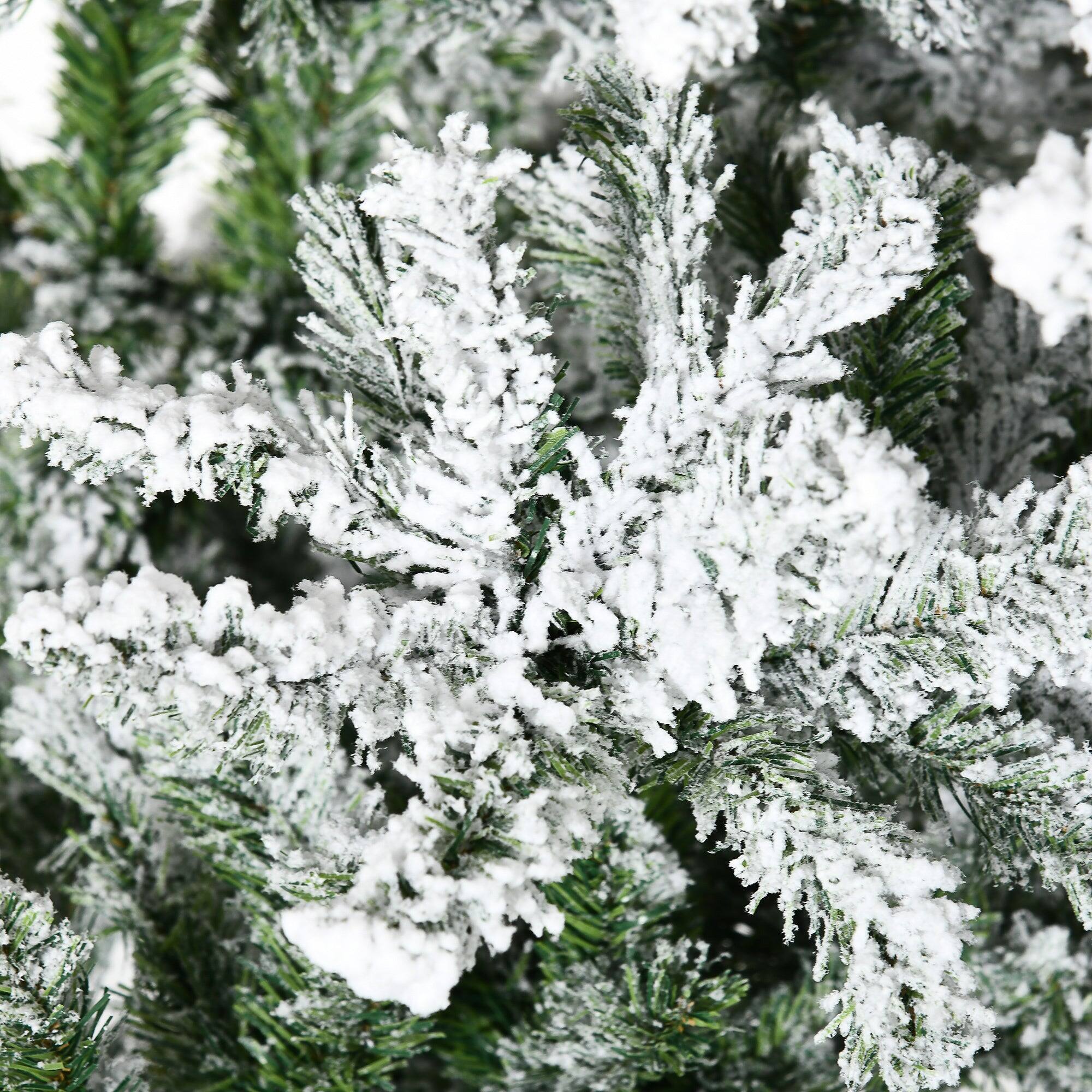 Back. BreeBe - 9 ft Tall Unlit Snow Flocked Pine Artificial Christmas Tree with Realistic Branches - Green.