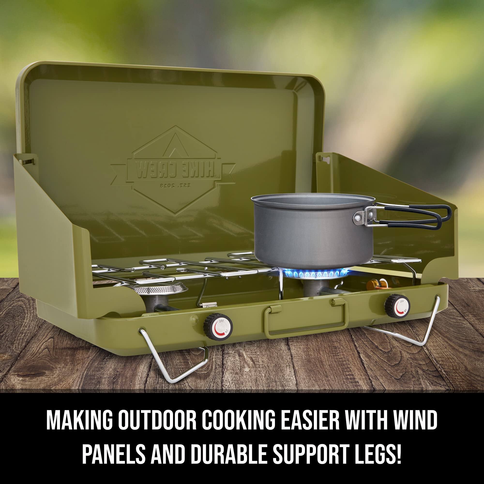 CREW HILGE 2013 137.  
MAKING OUTDOOR COOKING EASIER WITH WIND PANELS AND DURABLE SUPPORT LEGS!
