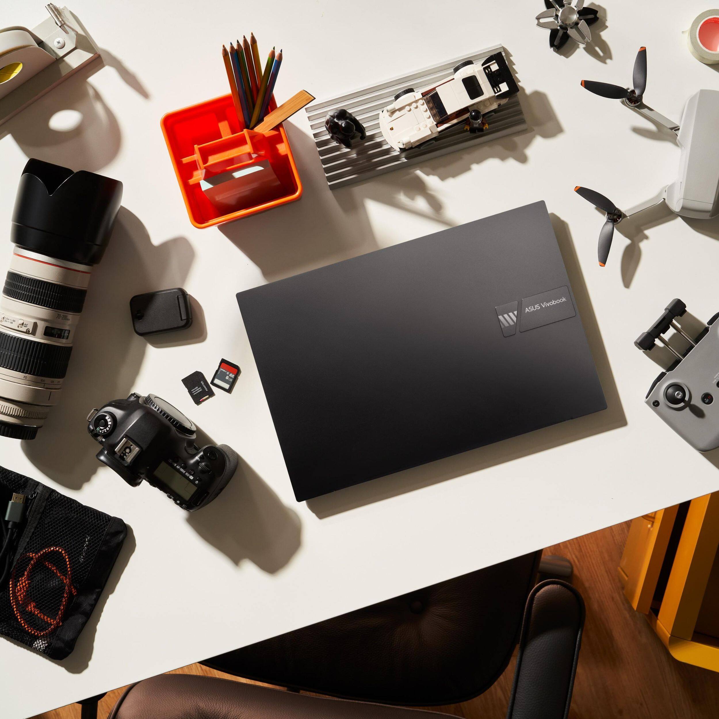 The text on the image reads "ASUS Vivobook AN I N SURLTE E11 I."