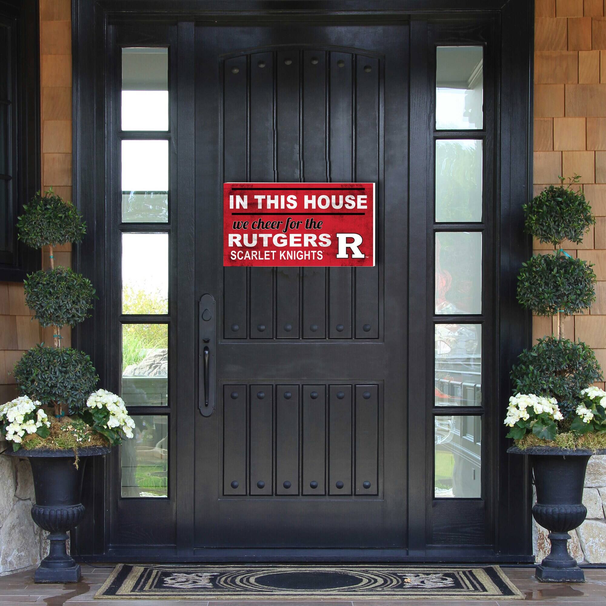 IN THIS HOUSE  
we cheer for the  
RUTGERS  
SCARLET KNIGHTS