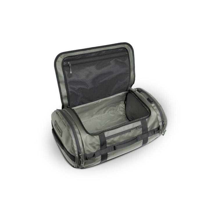Angle. WANDRD - WANDRD CARRYALL Duffel with Expandable Bottom Compartment (Wasatch Green, 40L) - Green.