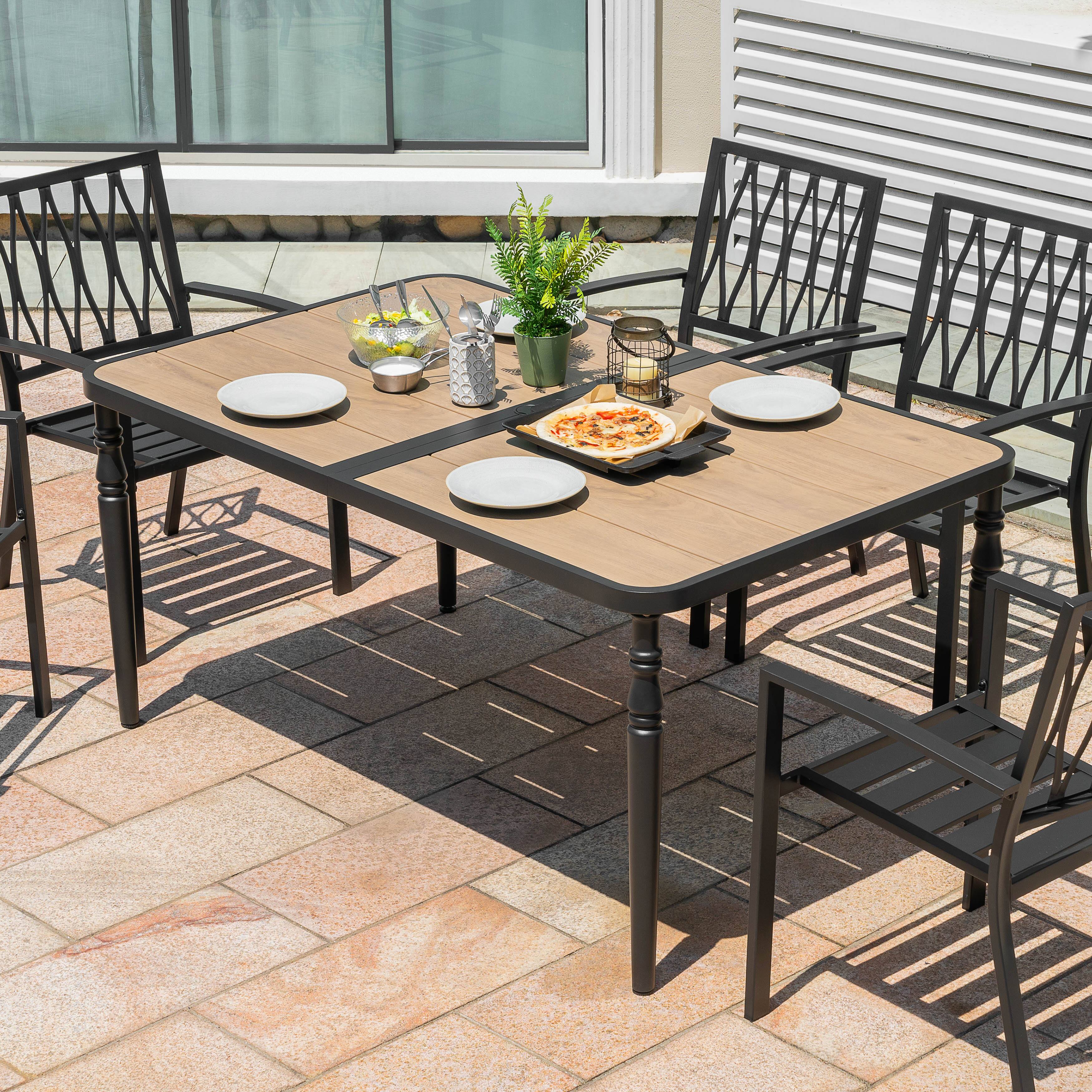 Angle. Nuu Garden - Outdoor Rectangle Metal Dining Table with Wood-Grain Tabletop, Umbrella Hole - Black and wood-grain finish.