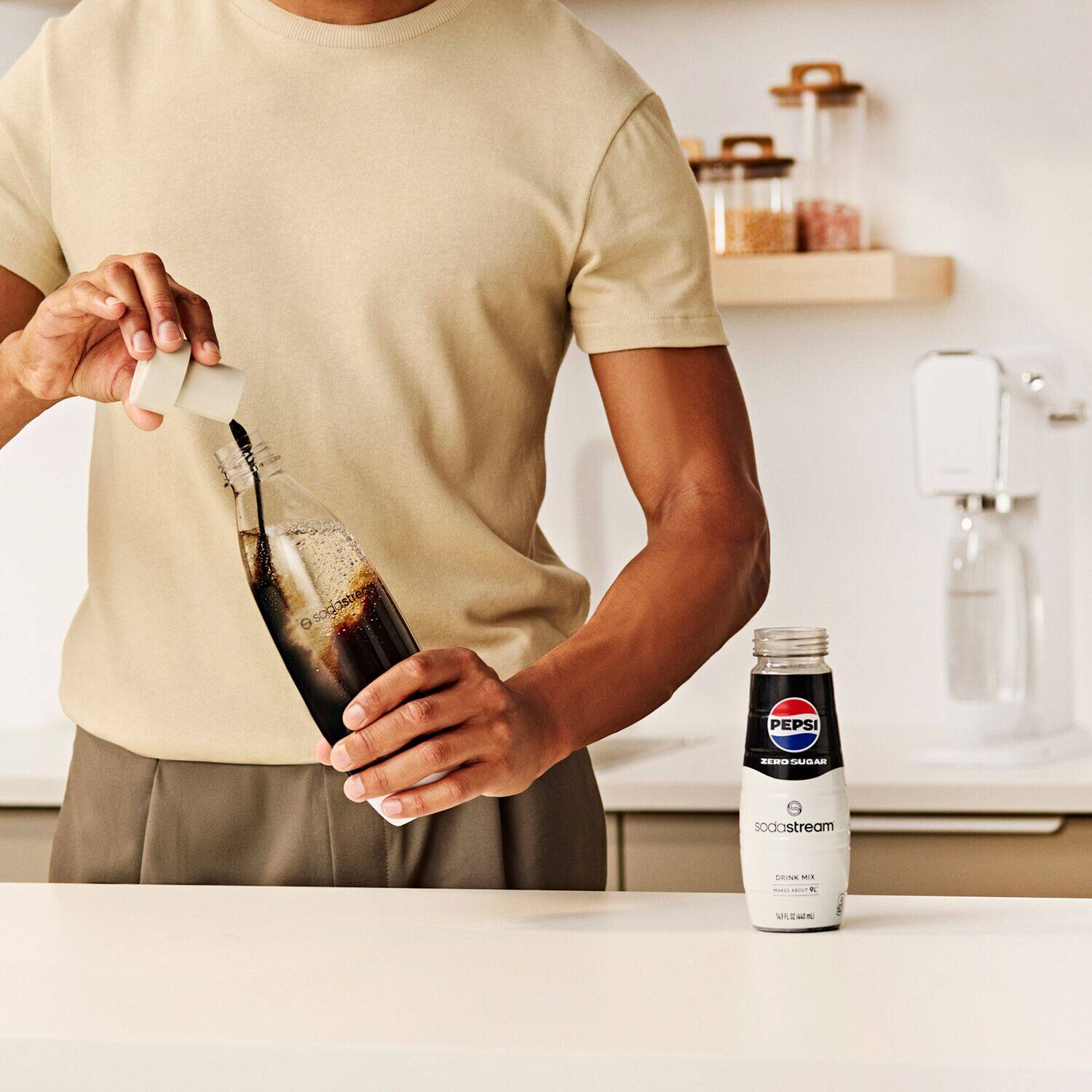 The text on the image reads: "Sogastieng dstreca SOP PEPSI 20 SUGAR - sodastream COONE - de W VAN." This text is likely a combination of different phrases or sentences, but it does not provide a clear meaning or context. It could be a description of a product, a recipe, or a message.