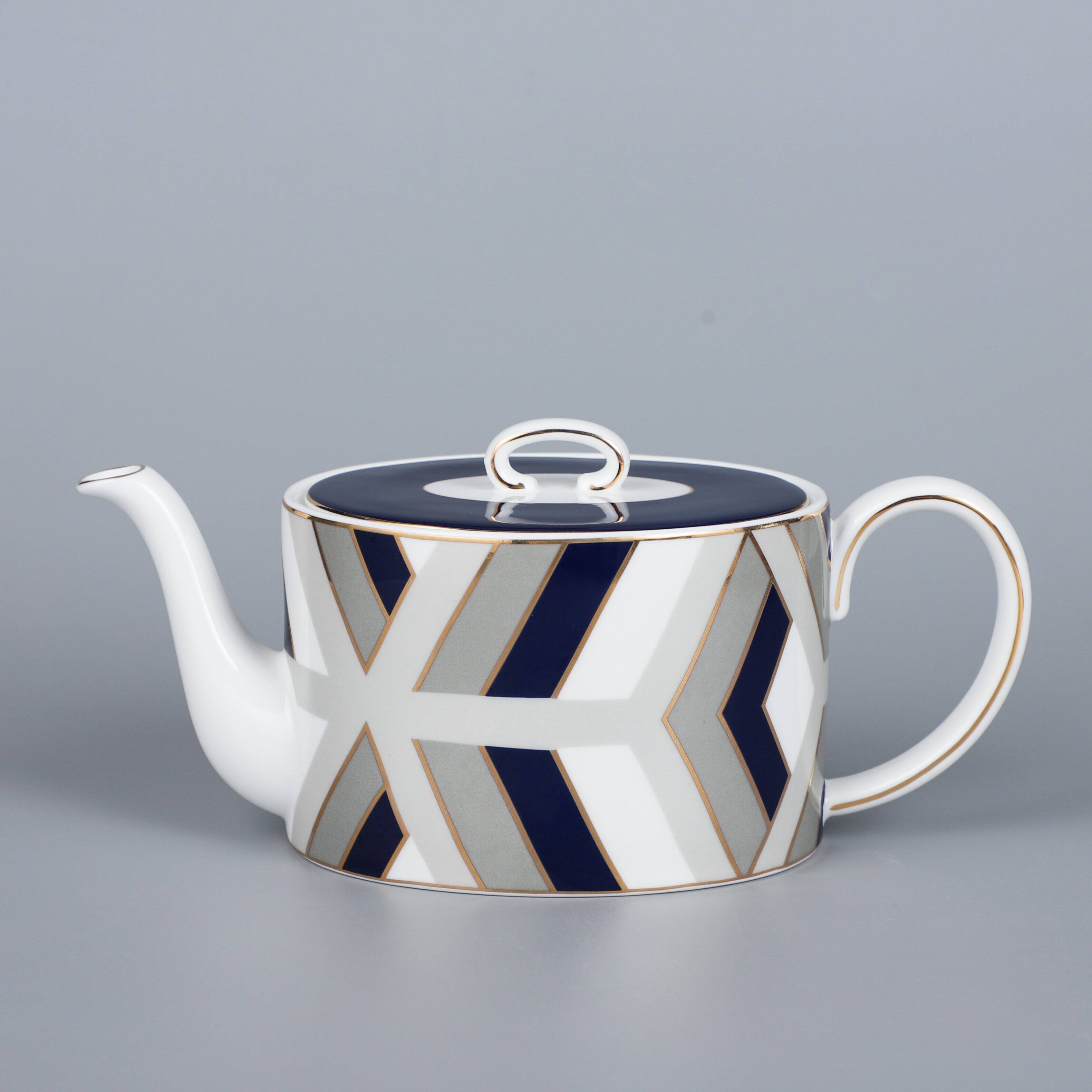 Left. Jiallo - The Elegance in Porcelain Tea Service Collection - 600 cc tea pot - Multi color.