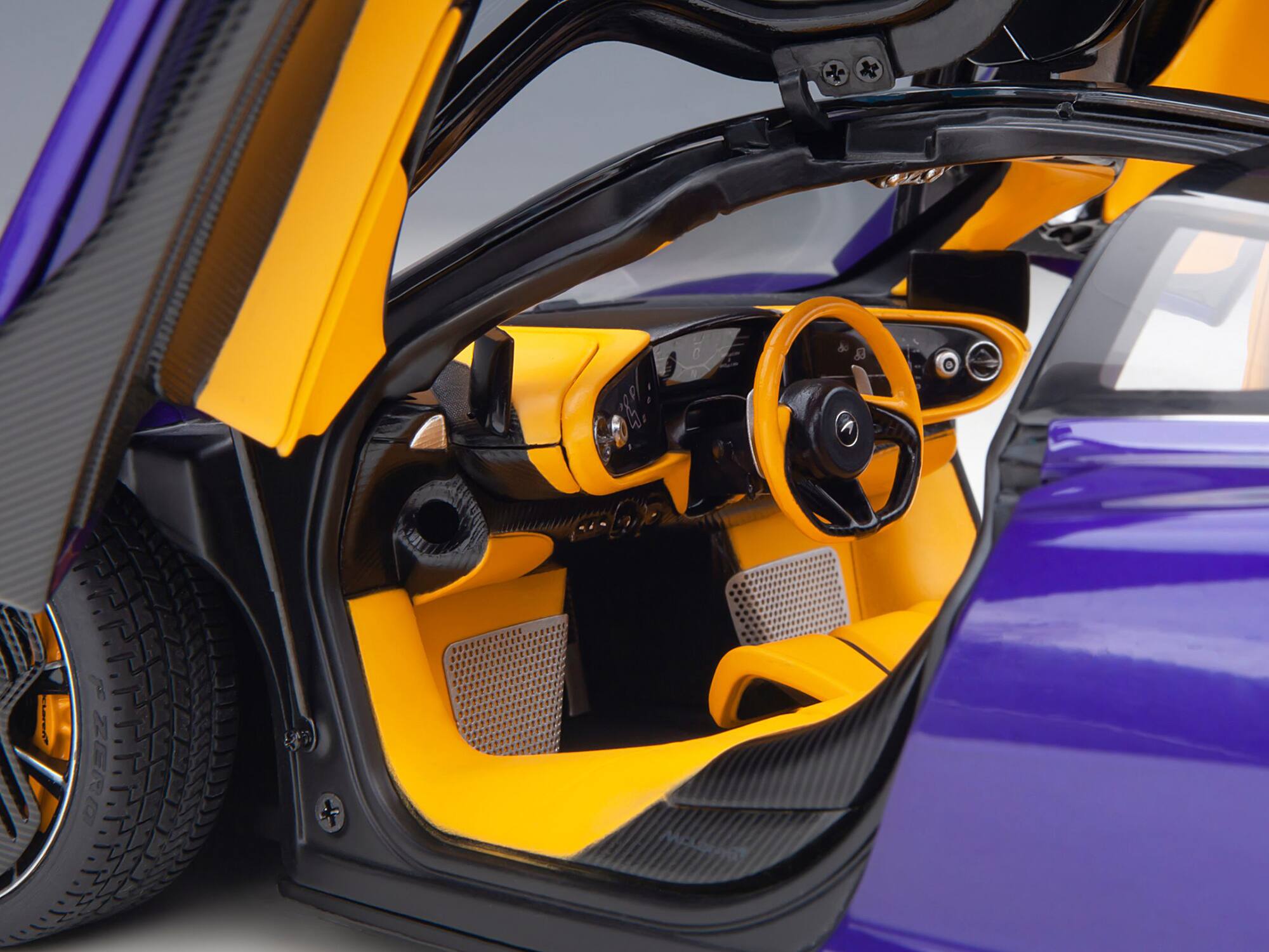 Alt View 3. Autoart - McLaren Speedtail Lantana Purple Met. w/Black Top and Yellow Interior and Suitcase Accessories 1/18 Model Car by Autoart.