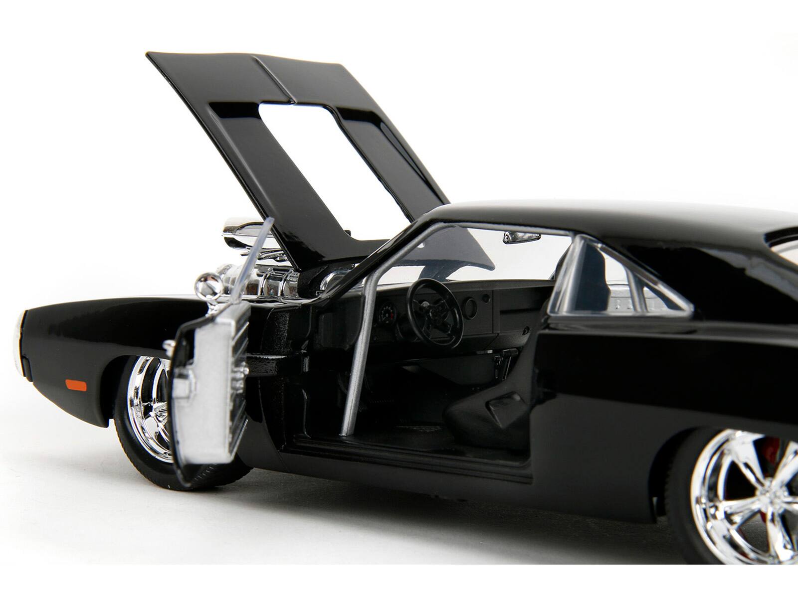 Left. Jada - 1970 Dodge Charger Black with Race Interior "Fast & Furious" Movie 1/24 Diecast Model Car by Jada - Black.