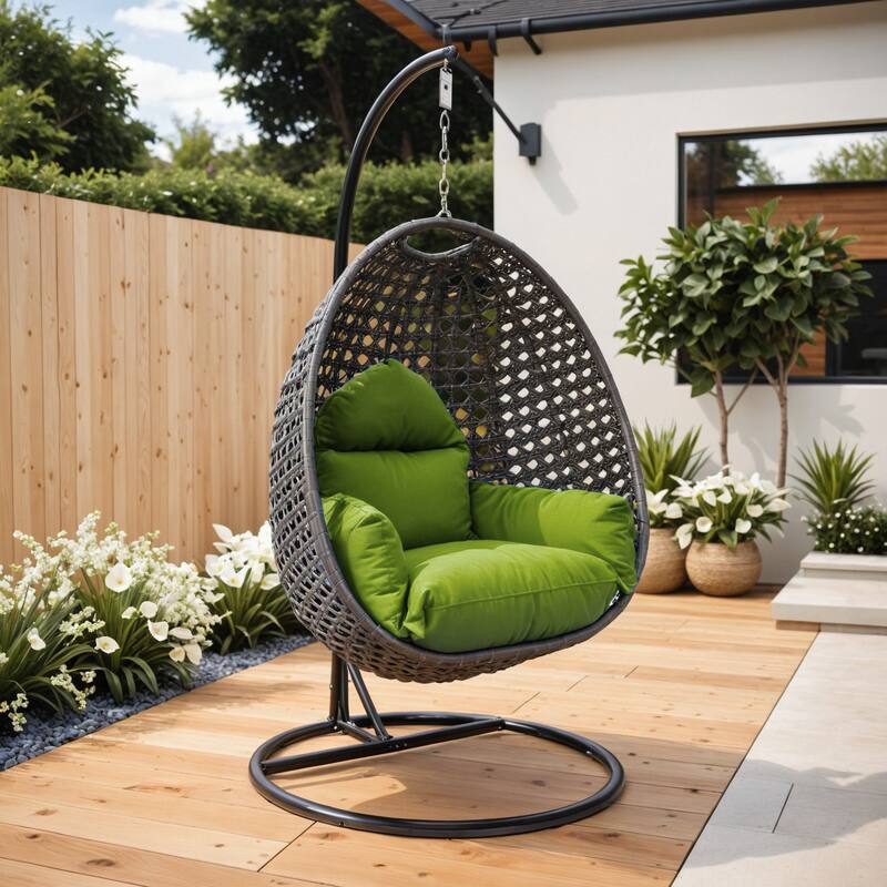 Angle. LeisureMod - LeisureMod Charcoal Wicker Outdoor Egg Swing Chair with Steel Stand - UV & Rust Resistant Single Seat for Patio - Light Green.