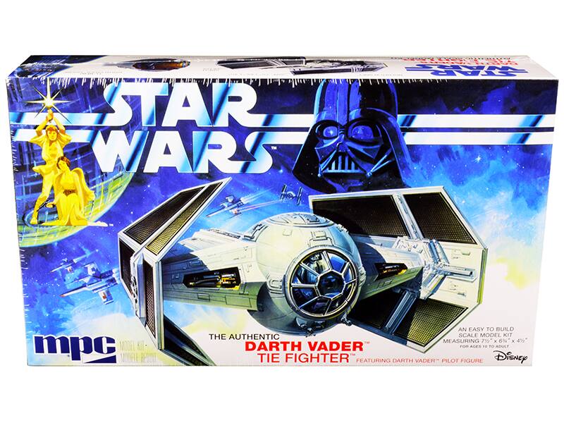 STAR WARS  
THE AUTHENTIC  
DARTH VADER TIE FIGHTER  
FEATURING DARTH VADER PILOT FIGURE  

AN EASY TO BUILD  
SCALE MODEL KIT  
MEASURING 7½" x 6½" x 4½"  
FOR AGES 10 TO ADULT  

mpc  
MODEL KIT - MODÈLE RÉGULIER  

Disney