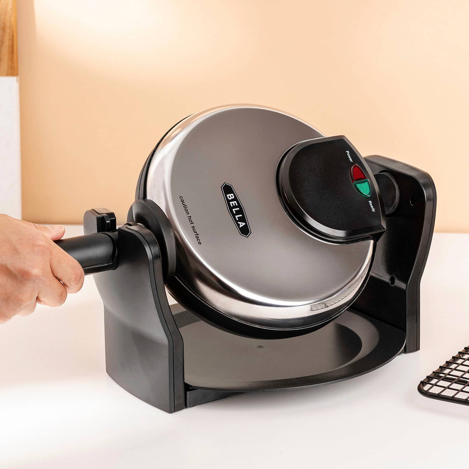 The text on the image reads "Pwrer caution hot surface BELLA Ready."