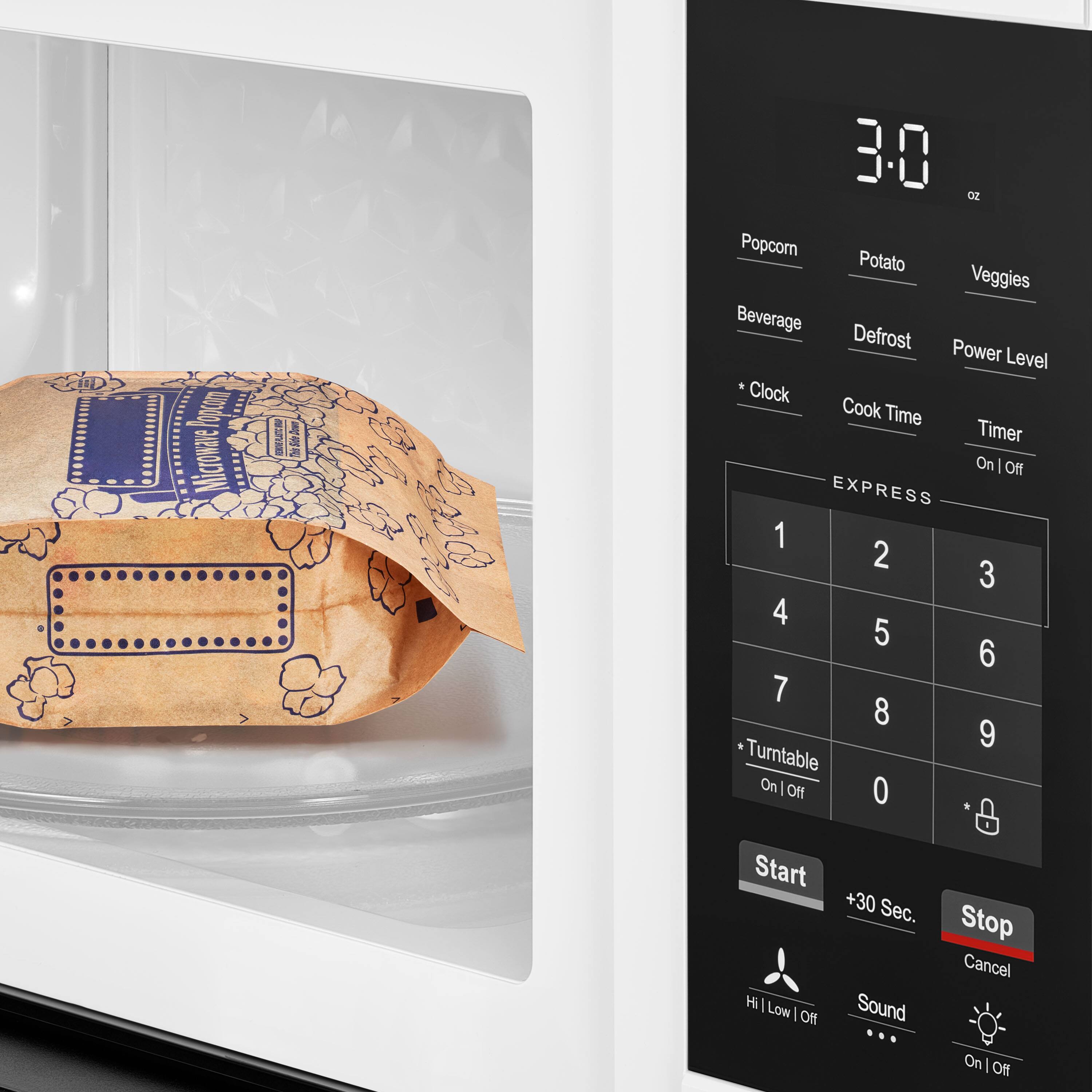 30 oz Popcorn Potato Veggies Beverage Defrost Power Level Clock Cook Time Timer On | Off EXPRESS 1 2 3 4 5 6 7 8 9 Turntable On | Off Start Hi | Low | Off +30 Sec. Sound On | Off Stop Cancel