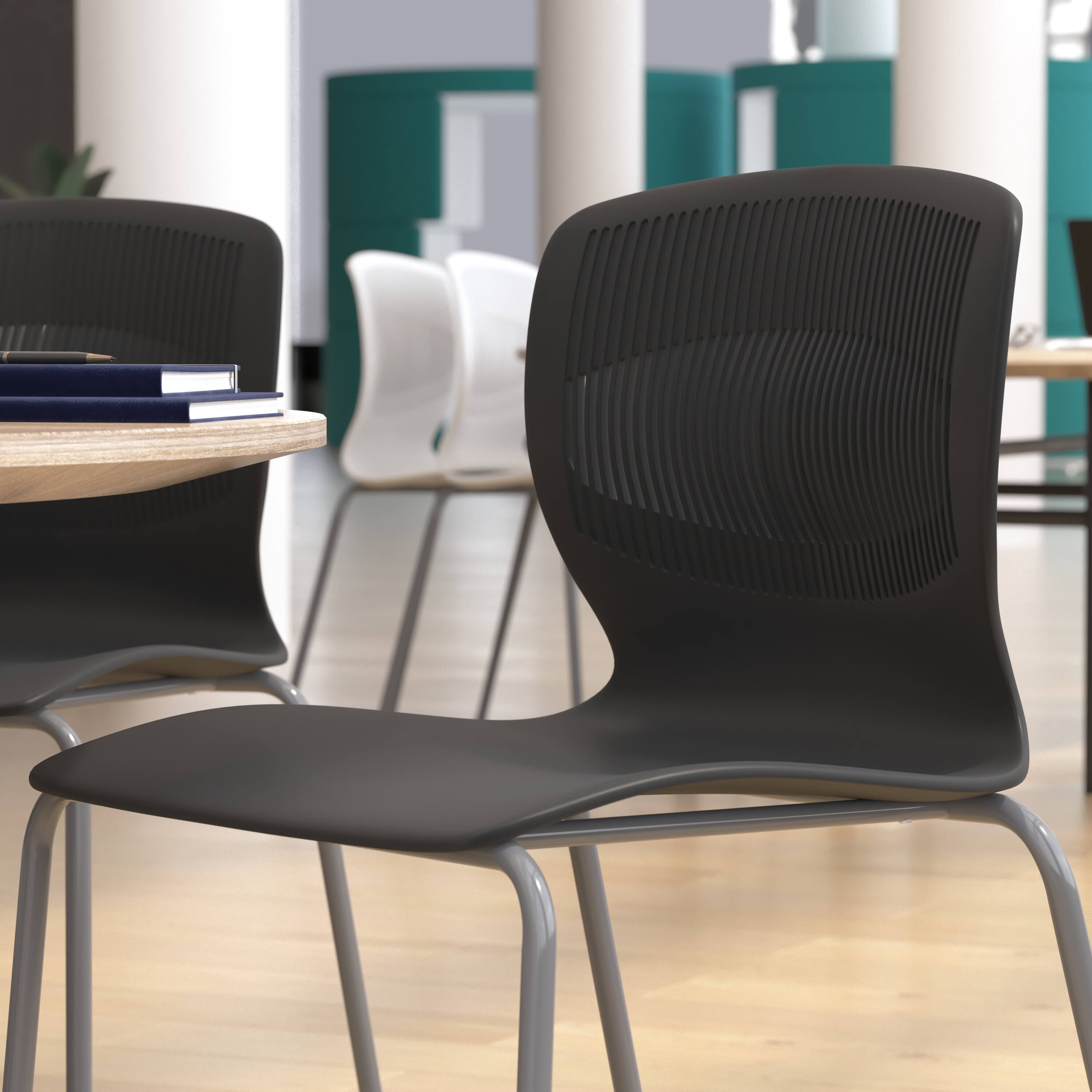 Alt View 4. Emma + Oliver - Arcana Series Heavy Duty 770 lb. Capacity Ergonomic Polypropylene Stack Chair with Lumbar Support and Steel Frame - Black.
