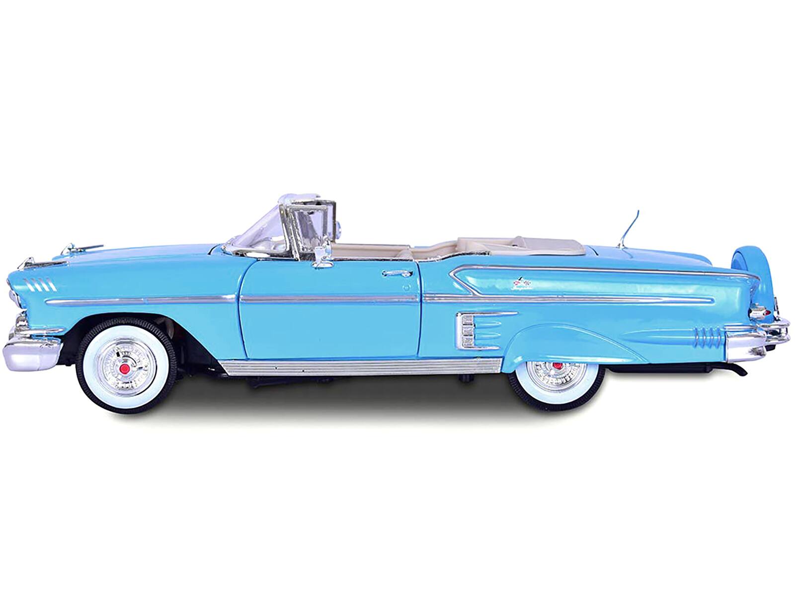 Alt View 1. Motormax - 1958 Chevrolet Impala Convertible Light Blue "Timeless Classics"  1/18 Diecast Model Car by Motormax.