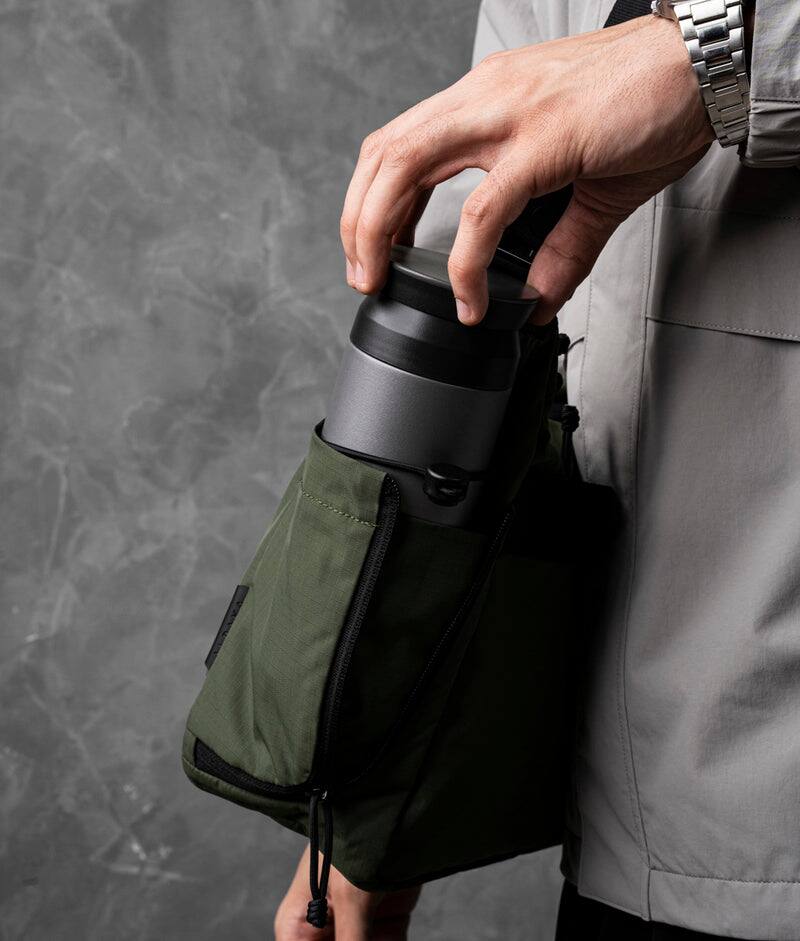 Left. ALPAKA - Laptop Messenger Satchel Bag 11L for Work & Travel, Fits 13" MacBook Air, Bottle Pockets, Luggage Pass-Through - Green Axoflux 210D.