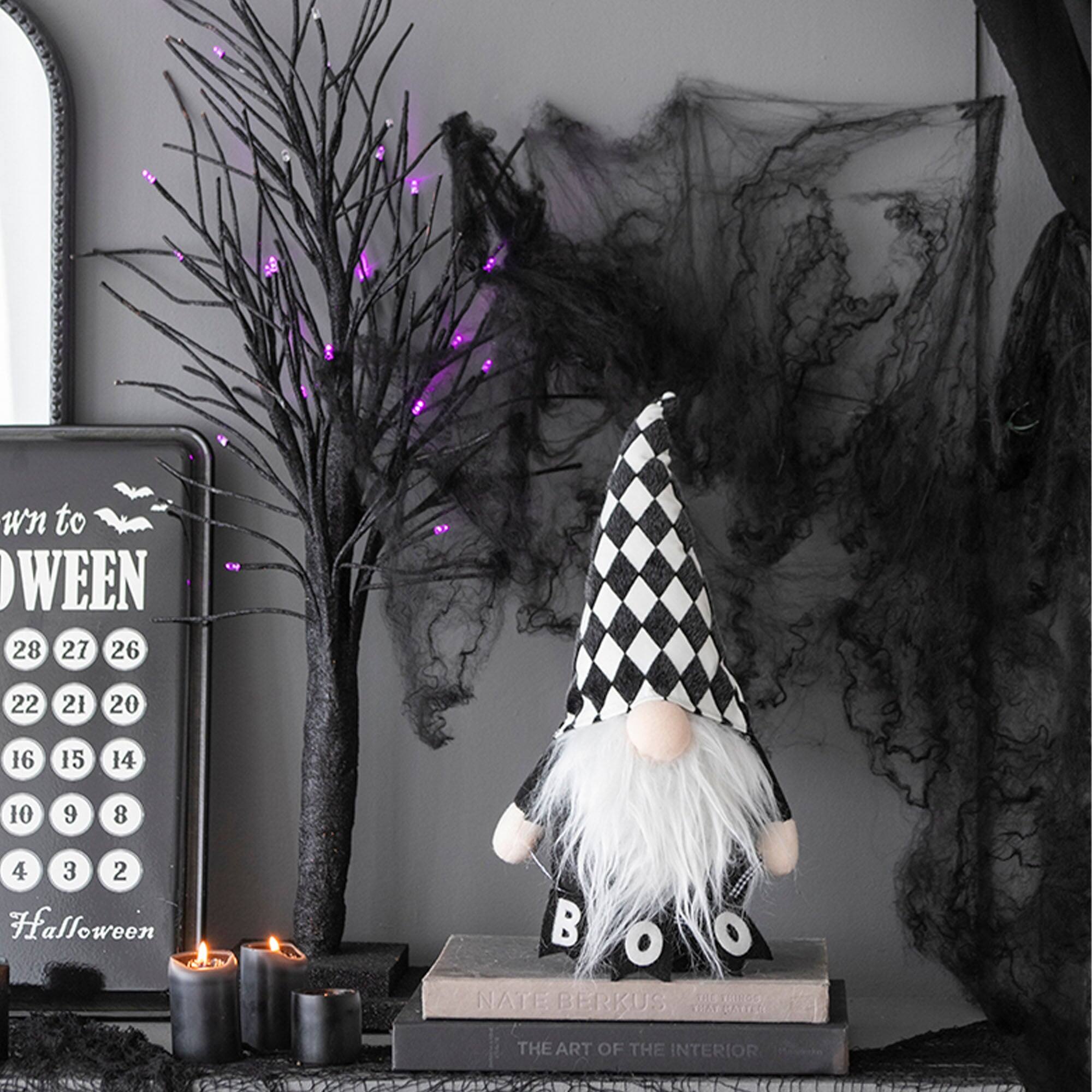 Sure, here is the corrected and grouped text from the image:

---

**Halloween**

28 27 26  
22 21 20  
16 15 14  
10 9 8  
4 3 2  

**Halloween**

**BOO**

**NATE BERKUS**  
**THE ART OF THE INTERIOR**

---

This text includes the Halloween-themed calendar, the word "BOO" on the witch's hat, and the book title.