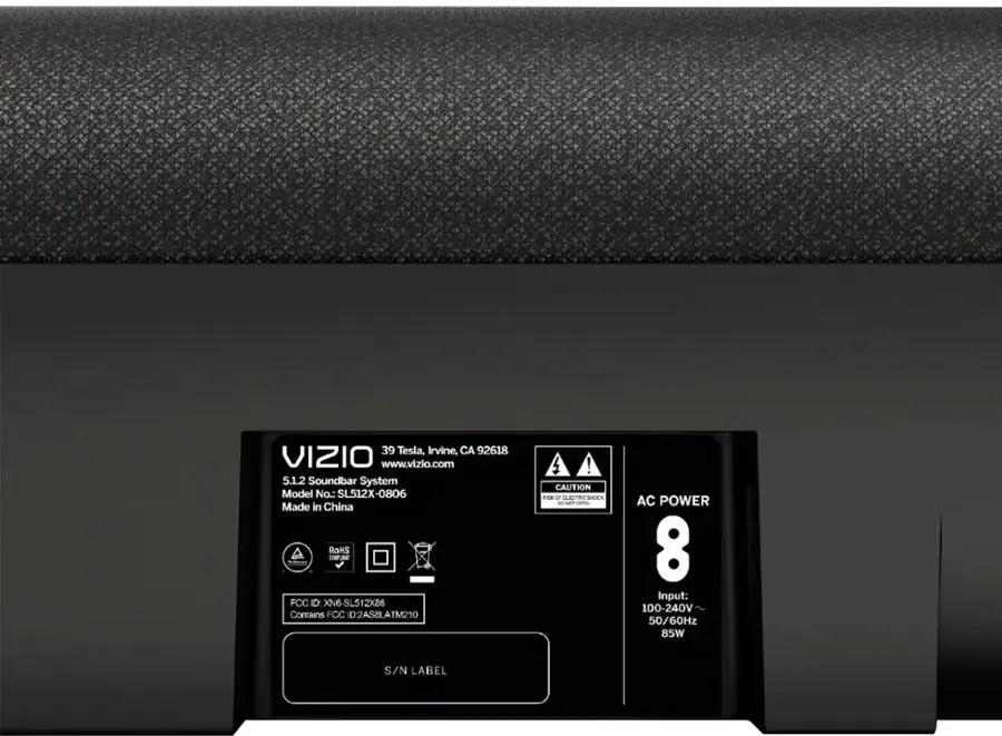 The text on the image reads:

"39 Tesla, Irvine, CA 92618 VIZIO [www.vizio.com](http://www.vizio.com) 5.1.2 Soundbar System Model No.: SL512X-0806 Made in China ROHS SEPUE FCC ID: XN6-SL512X86 Contains FCC D2ASBLATM210 4 ! CAUTION ESA0 CLETRE SEKS a N ars AC POWER 8 Input: 100-240V 50/60Hz 85W S/N LABEL"

The text has been grouped and corrected as follows:

"39 Tesla, Irvine, CA 92618 VIZIO [www.vizio.com](http://www.vizio.com) 5.1.2 Soundbar System Model No.: SL512X-0806 Made in China ROHS SEPUE FCC ID: XN6-SL512X86 Contains FCC D2ASBLATM210 4 ! CAUTION ESA0 CLETRE SEKS a N ars AC POWER 8 Input: 100-240V 50/60Hz 85W S/N LABEL"