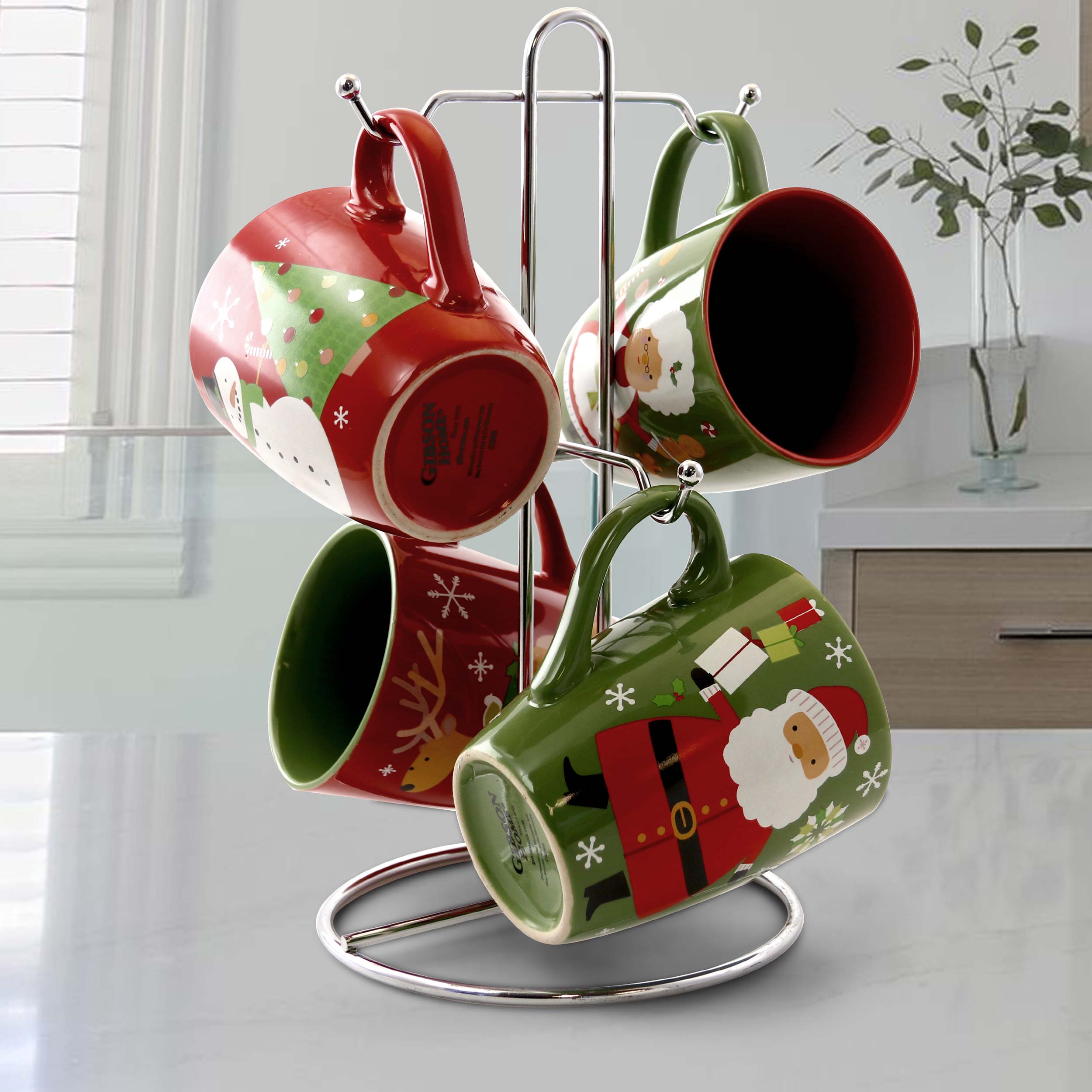 The image features a coffee cup rack with four coffee cups, each with a different design. The cups are arranged in a circular fashion, with one cup at the top, one at the bottom, and two cups on the sides. The cups are colorful and visually appealing, making them an attractive addition to any kitchen or coffee station.