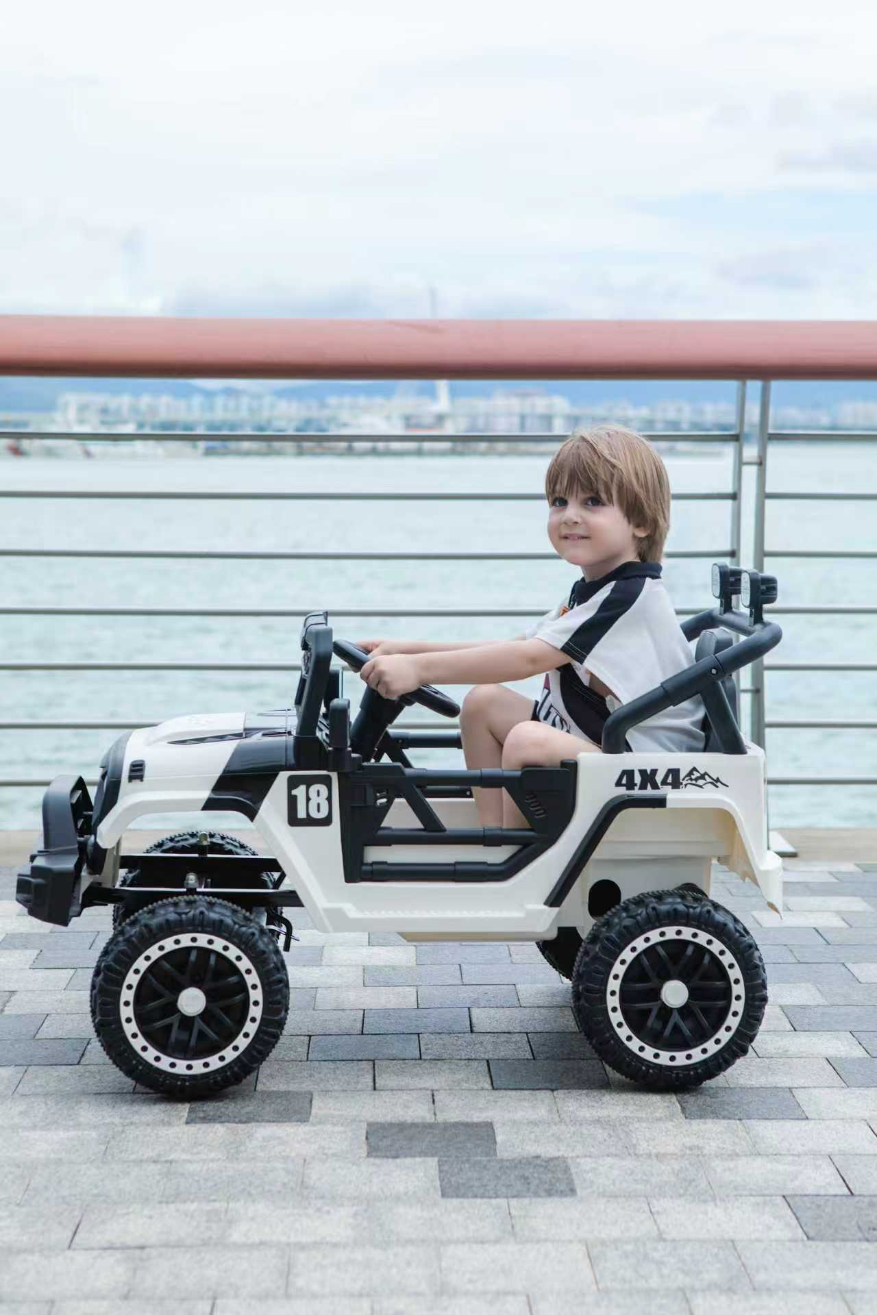 Angle. BreeBe - 12V Kids Ride-On Car with Parental Remote, Spring Suspension, LED Lights, Music Player, White/Black - Black, White.