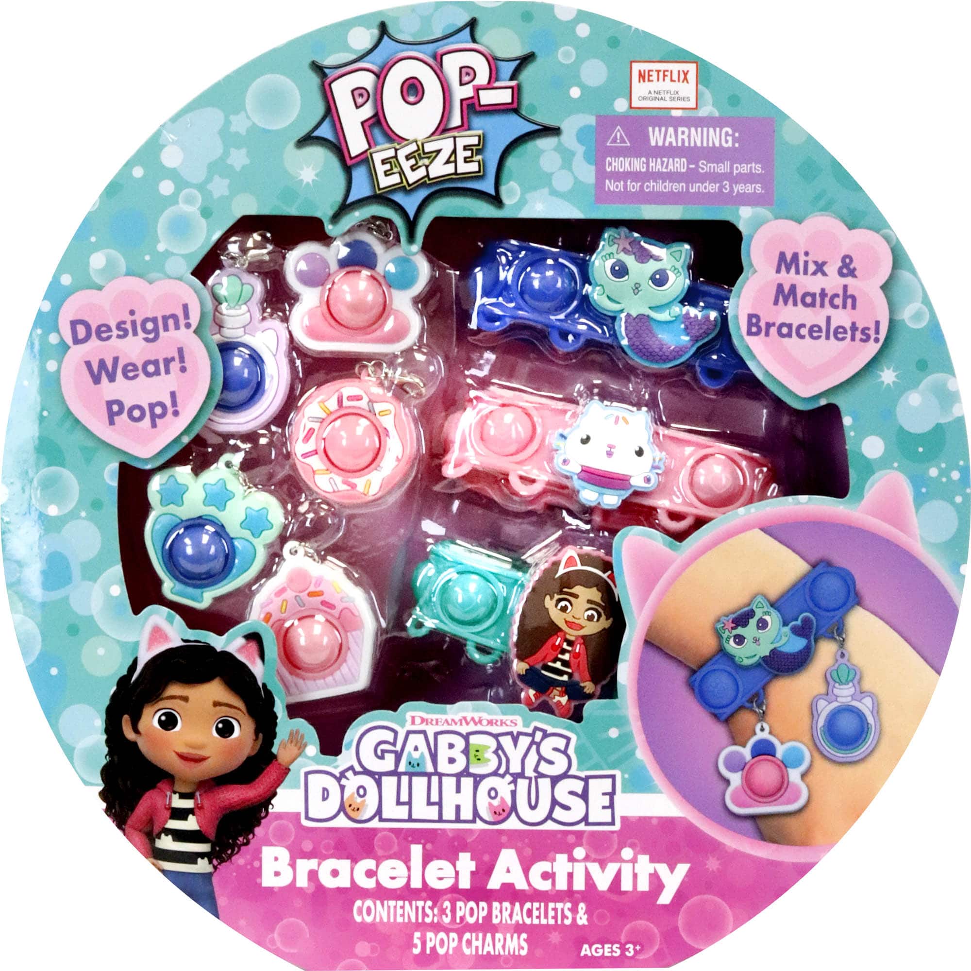 The text on the image is grouped and corrected as follows:

"For ages 3+. Design! Wear! Pop! Mix & Match Bracelets! Dreamworks Gabby's Dollhouse Bracelet Activity. Contents: 3 Pop Bracelets & 5 Pop Charms. Warning: Choking Hazard-Small parts. Not for children under 3 years."
