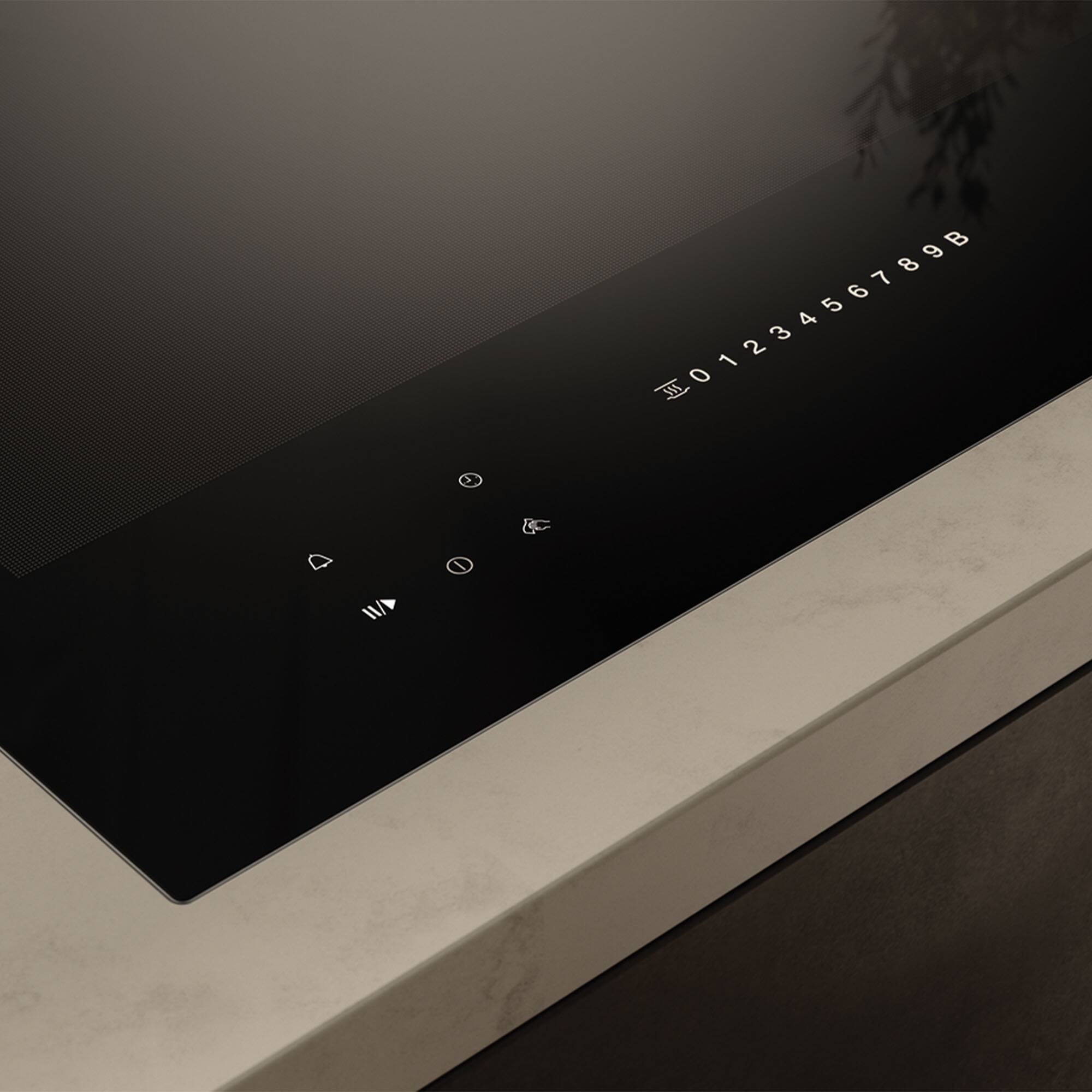 Angle. Miele - KM 7737 FL Diamond 30" Frameless Full-Surface Smart Induction Cooktop with DiamondFinish - Graphite Black.