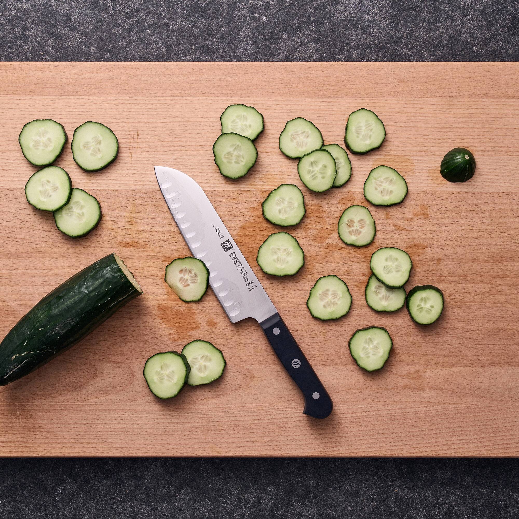 Alt View 5. ZWILLING - ZWILLING Gourmet 7-inch Hollow Edge Santoku Knife - Black.