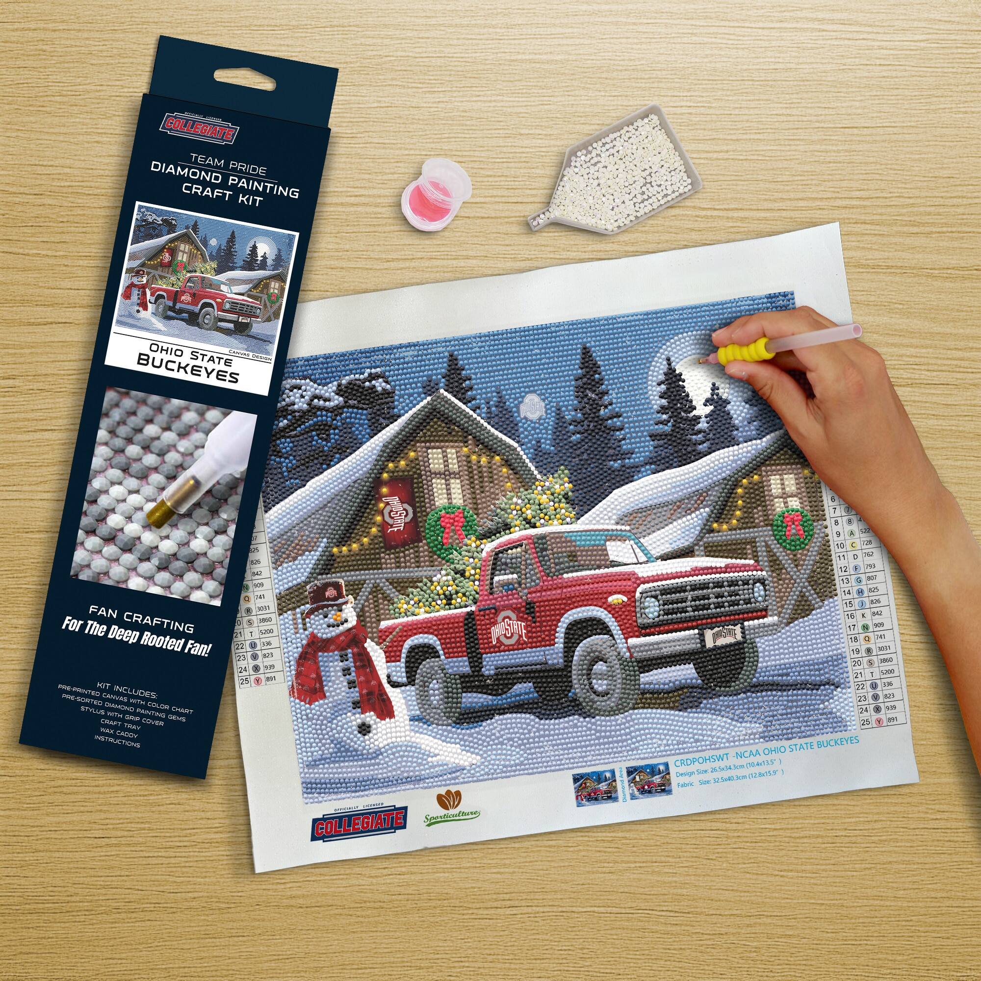 COLLEGIATE  
TEAM PRIDE  
DIAMOND PAINTING CRAFT KIT  

OHIO STATE BUCKEYES  

FAN CRAFTING  
For The Deep Rooted Fan!  

KIT INCLUDES:  
- PREMIUM CANVAS  
- DIAMOND STONE PAINTING CHART  
- DIAMOND STONE PAINTING GUIDE  
- CRAFTING TOOL COVER  
- INSTRUCTIONS  

CRDP05HWT NCAA OHIO STATE BUCKEYES  
Design Size: 24" x 18" (61 cm x 46 cm)  
Frame Size: 26" x 20" (66 cm x 51 cm)  

COLLEGIATE  
Sparkle & Shine
